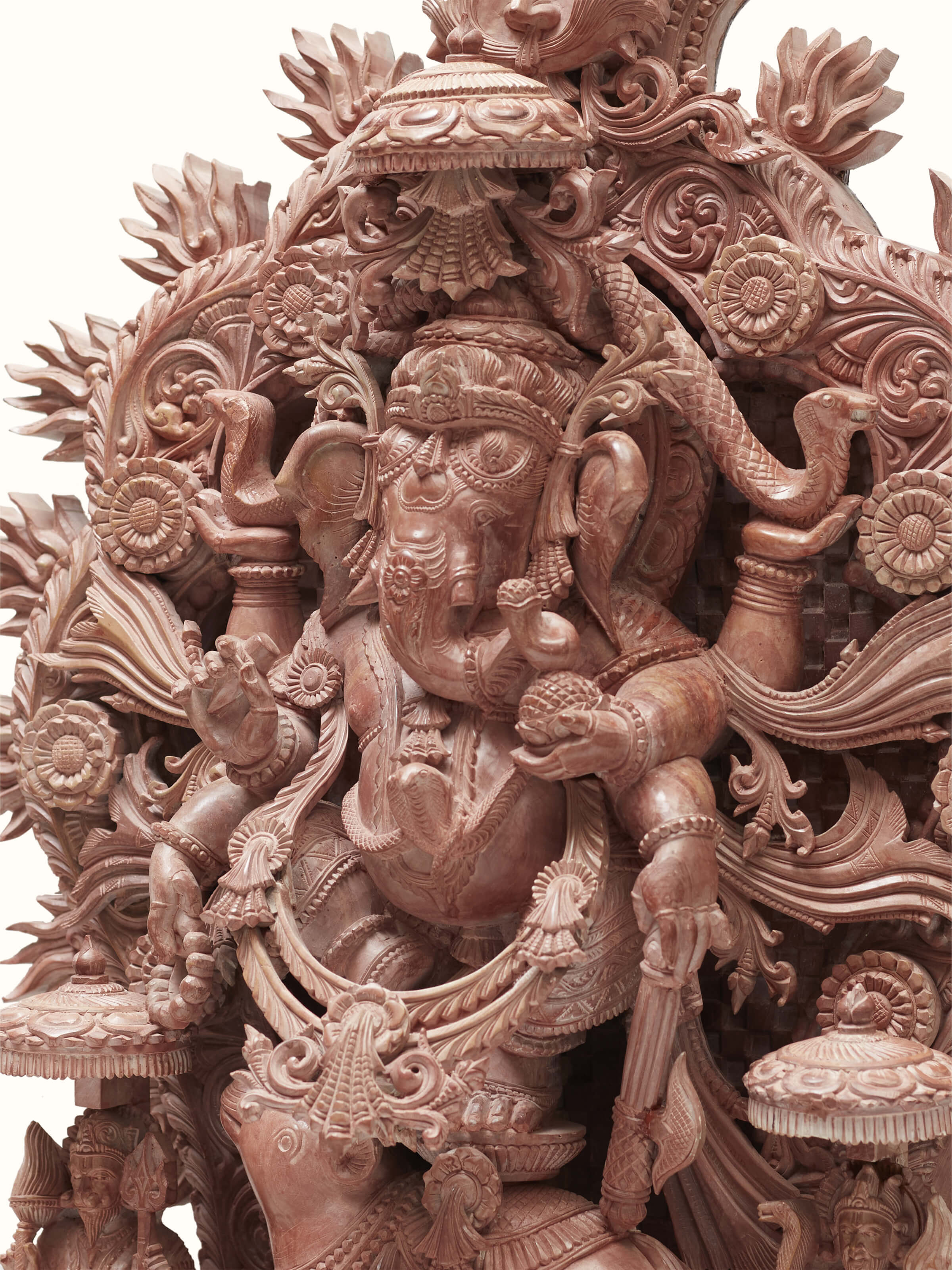 Artistic view of carved stone Vinayaka idol, highlighting the overall design and stone texture.