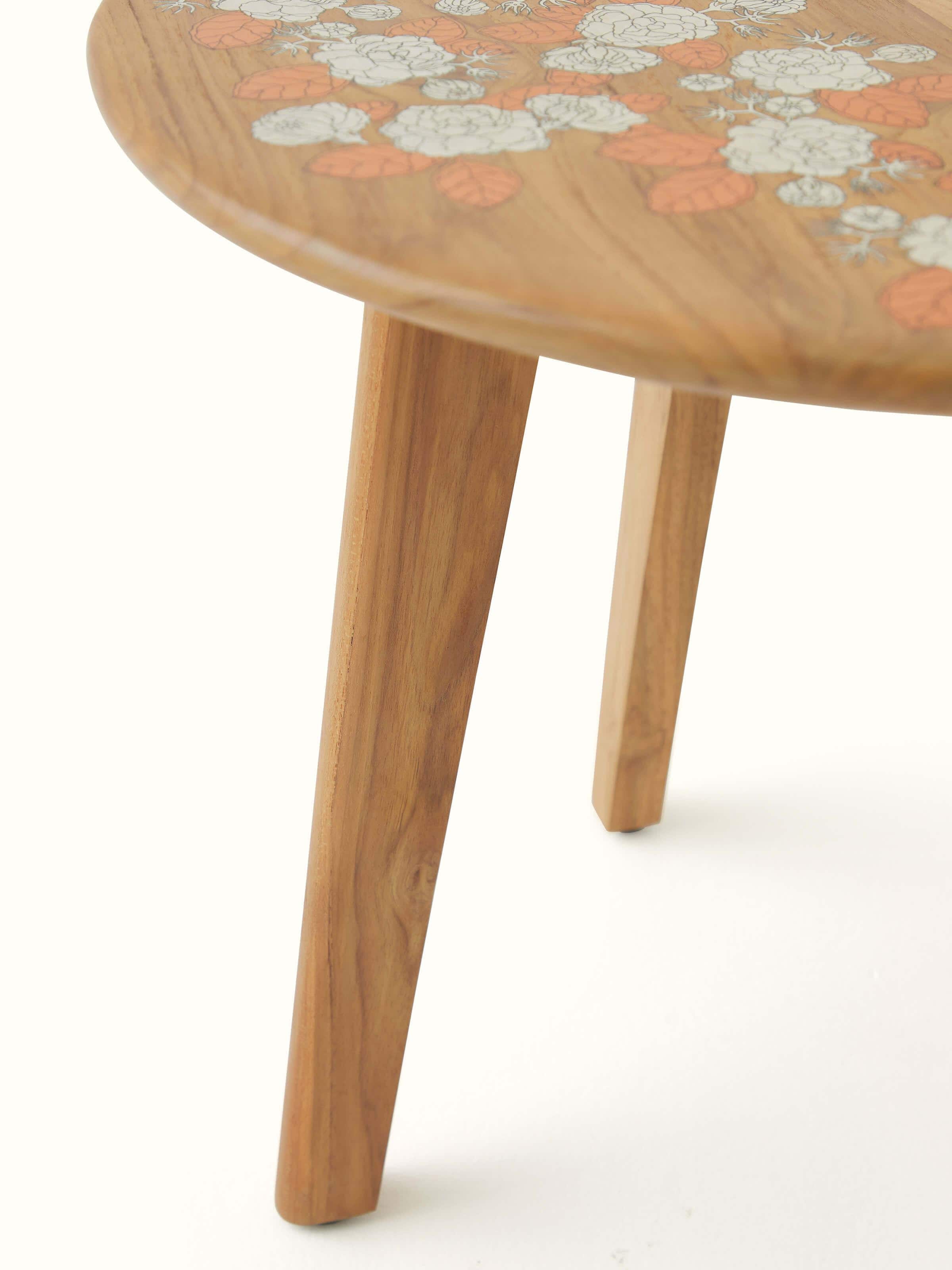Detailed view of Teak Wood Pattachitra Round Side Table highlighting the texture and finish of the wood