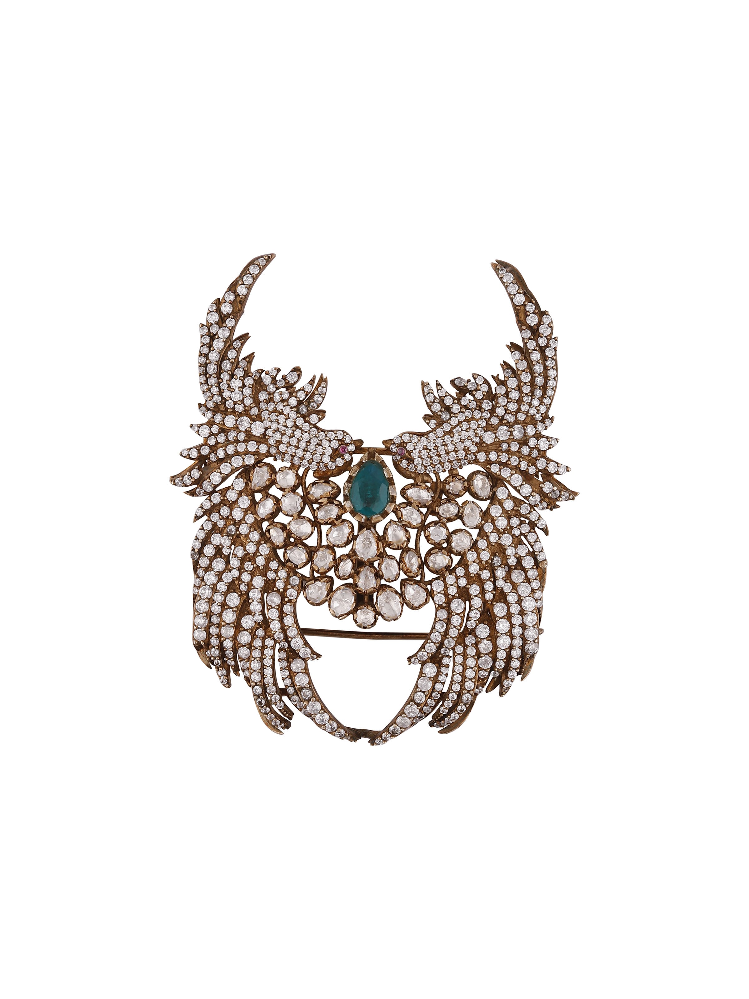 front view of silver smithing yellow gold brooch pin with intricate design