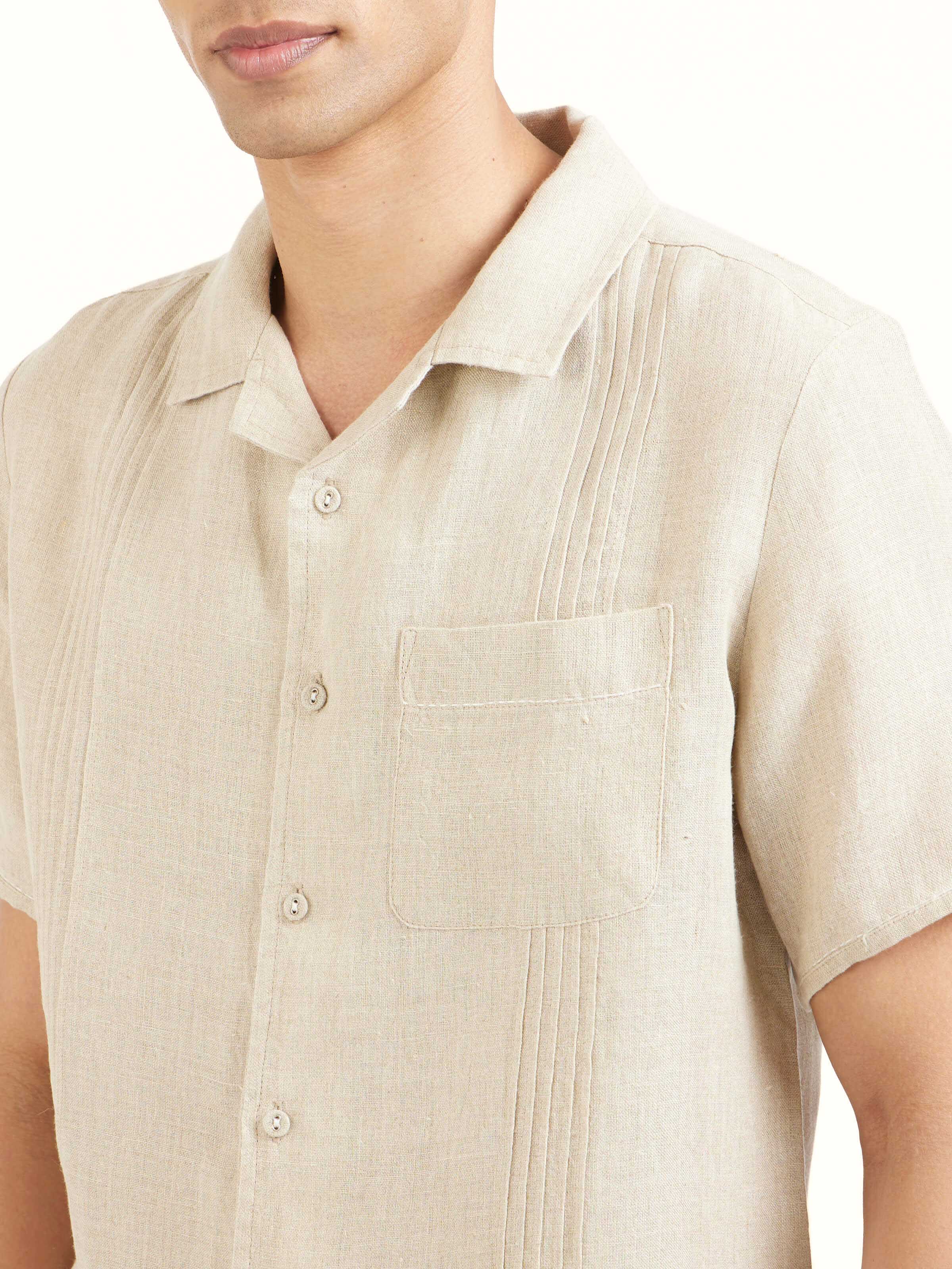 Detail view of beige Cuban collar linen shirt showing fabric weave