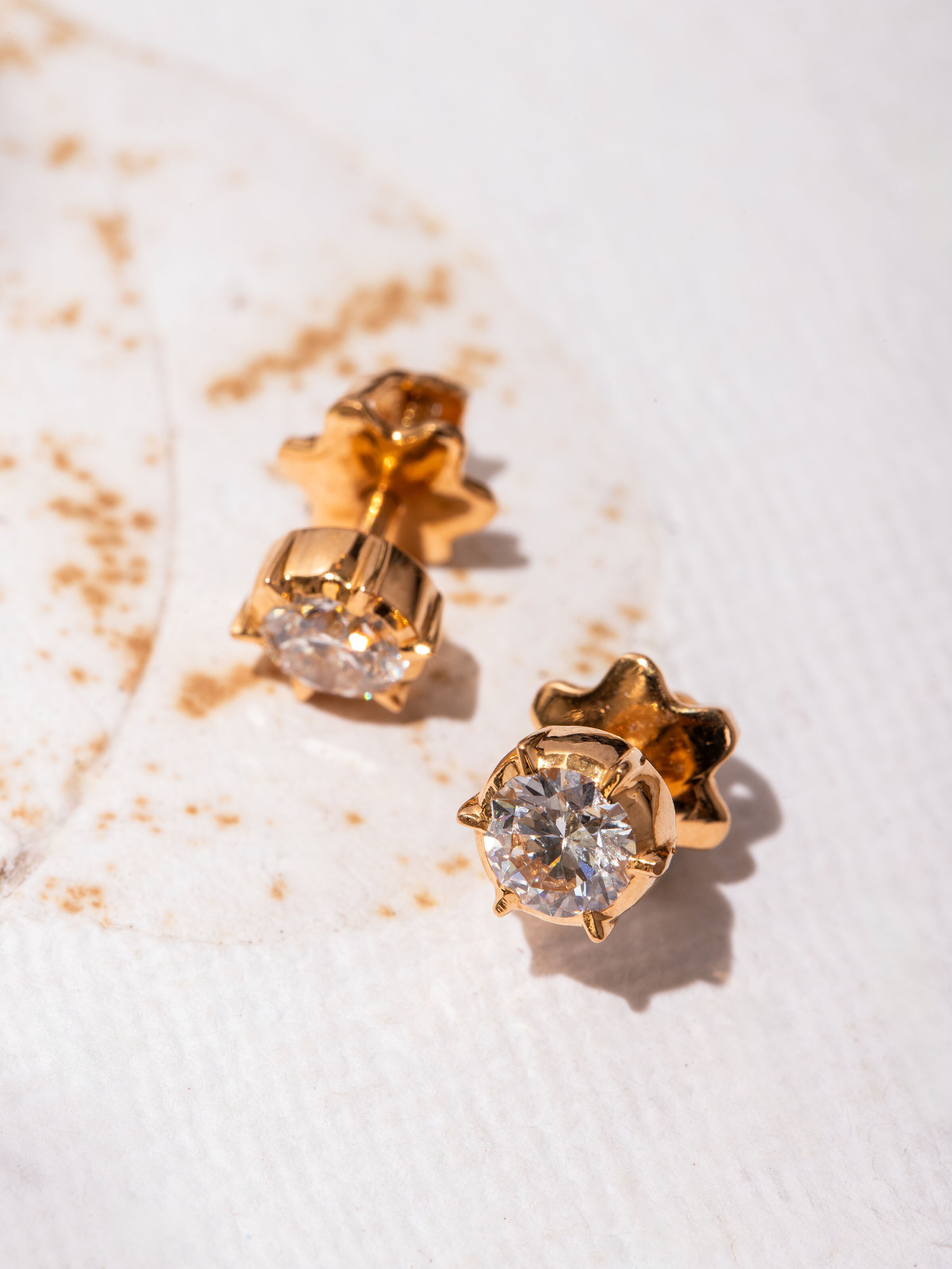 Detail shot of Close-setting 22 Karat Gold Studs highlighting the intricate close-set goldwork.