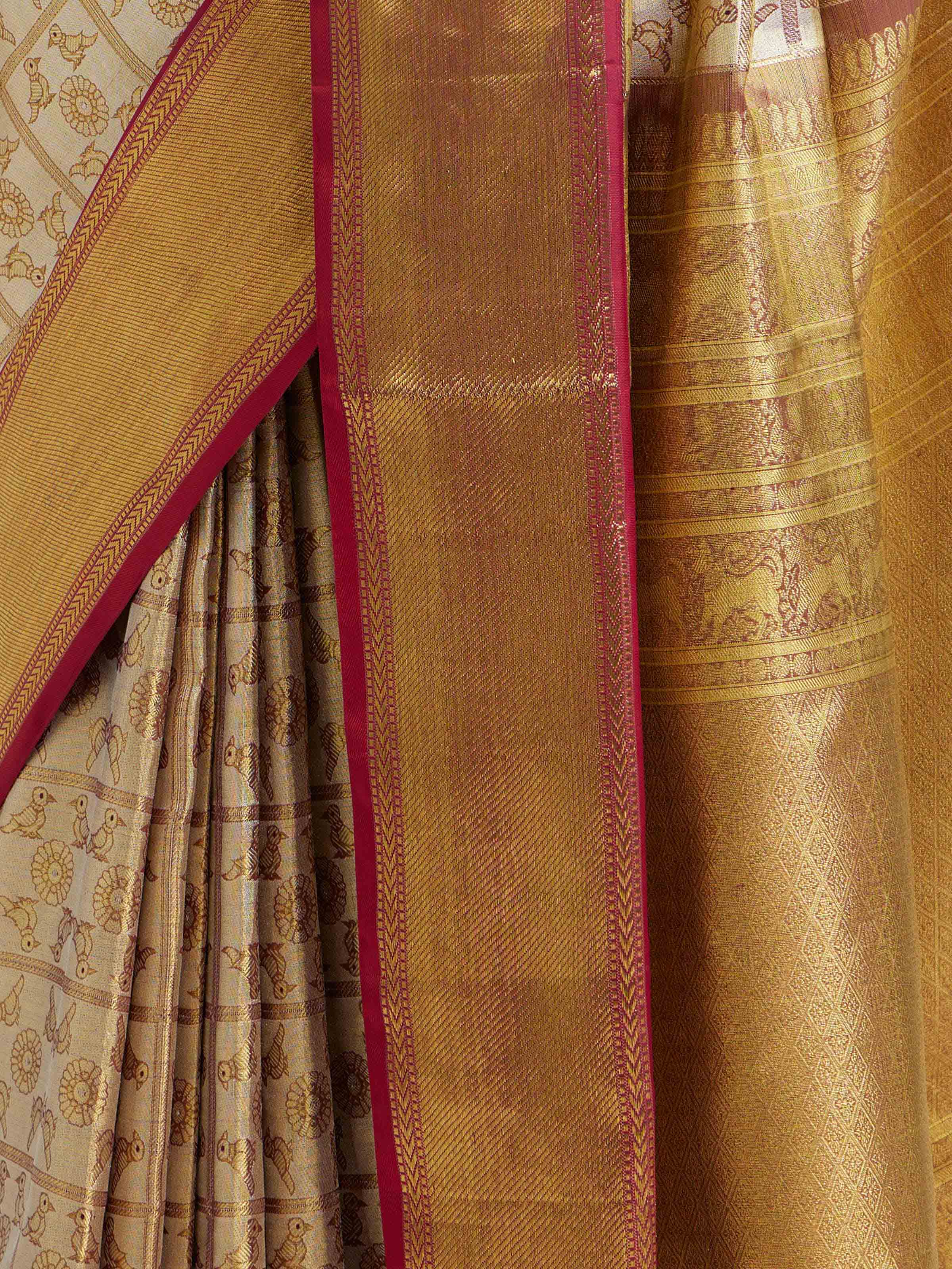 Detail view of gold silk Kancheepuram saree showing silk texture and zari craftsmanship