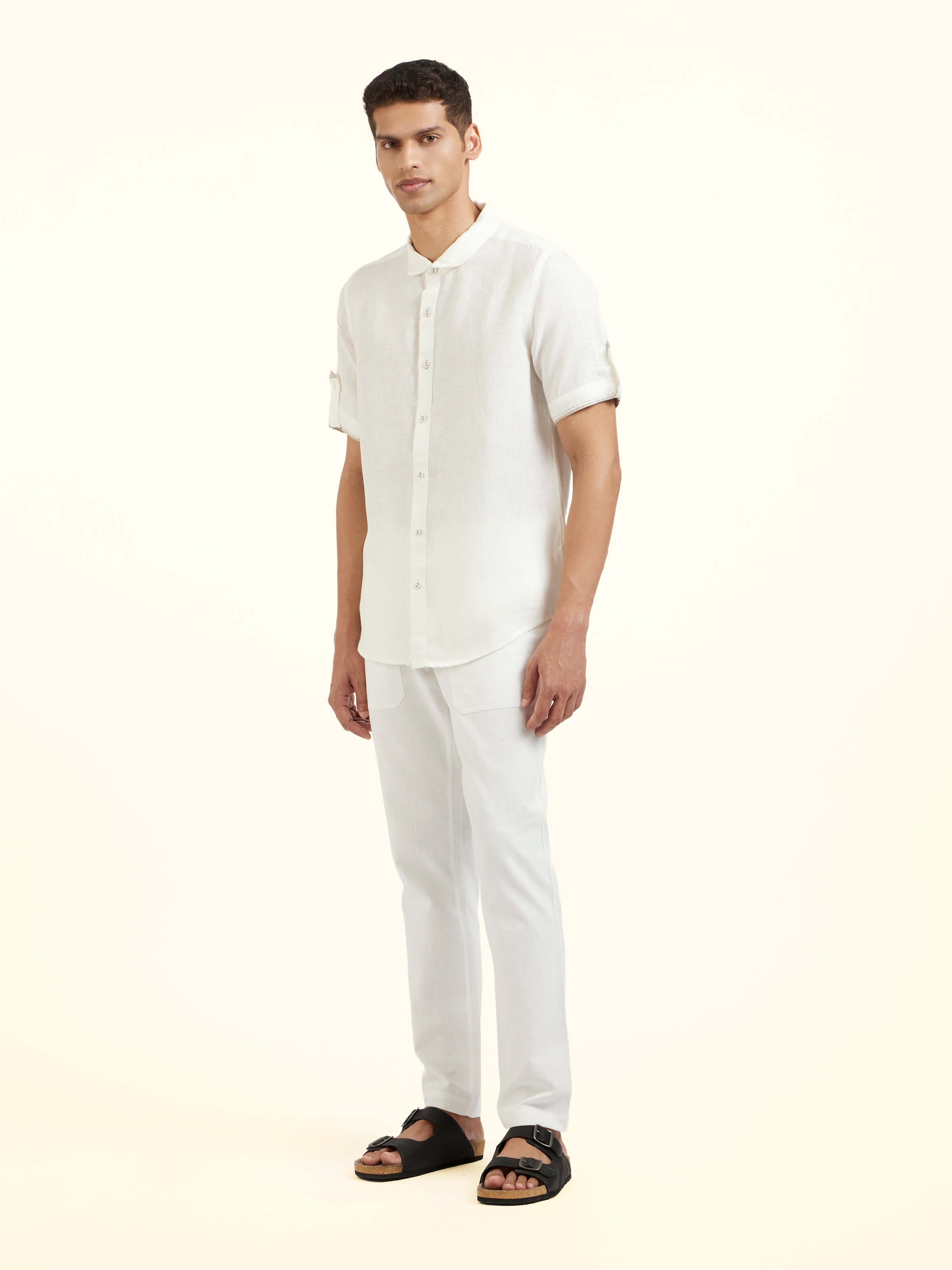 Side view of white Peter Pan collar linen shirt with relaxed silhouette