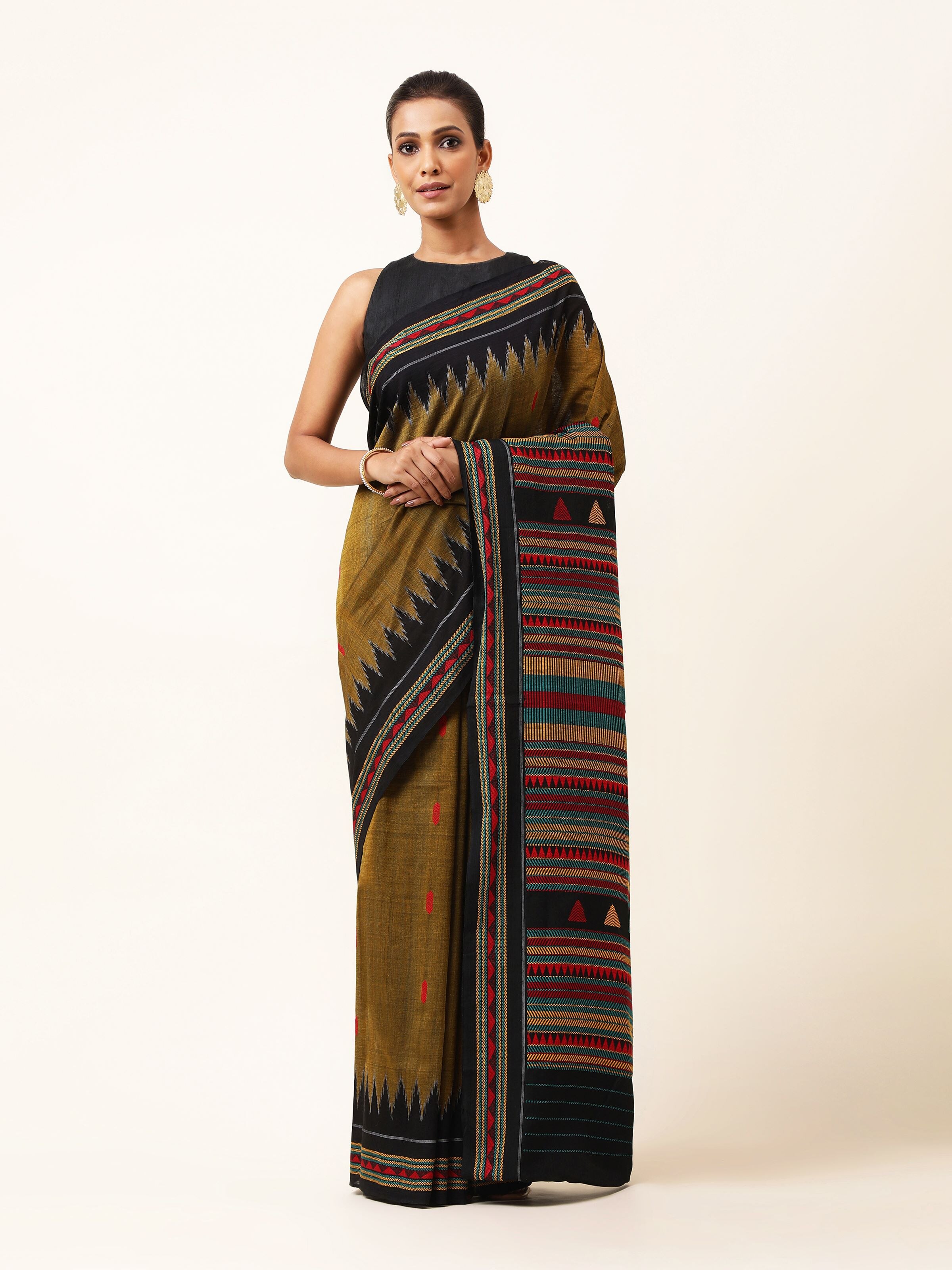 Front view of yellow cotton Dongaria saree with tribal-inspired motifs and traditional weave