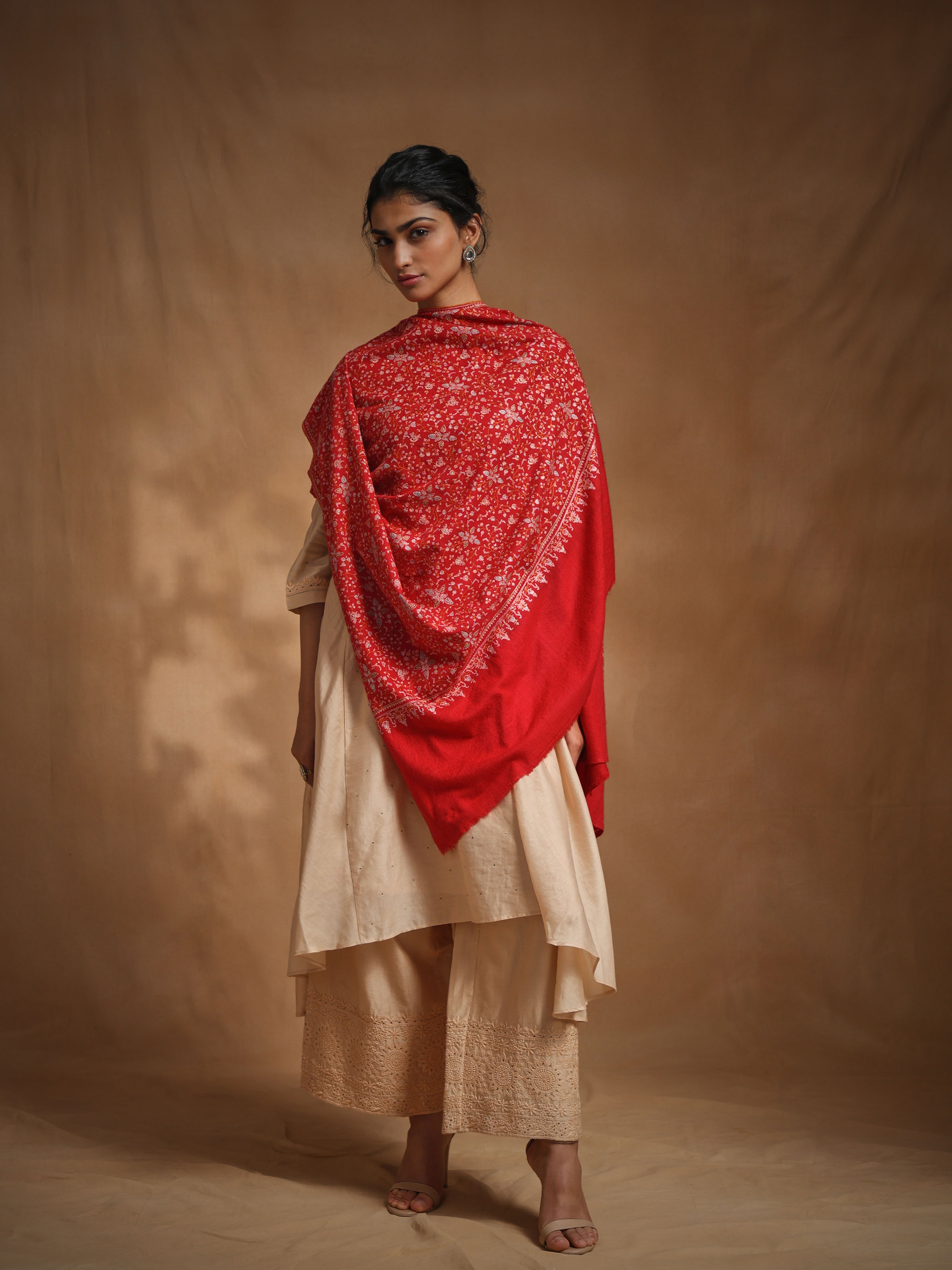 Side view of cashmere sozni embroidered shawl showcasing drape and texture