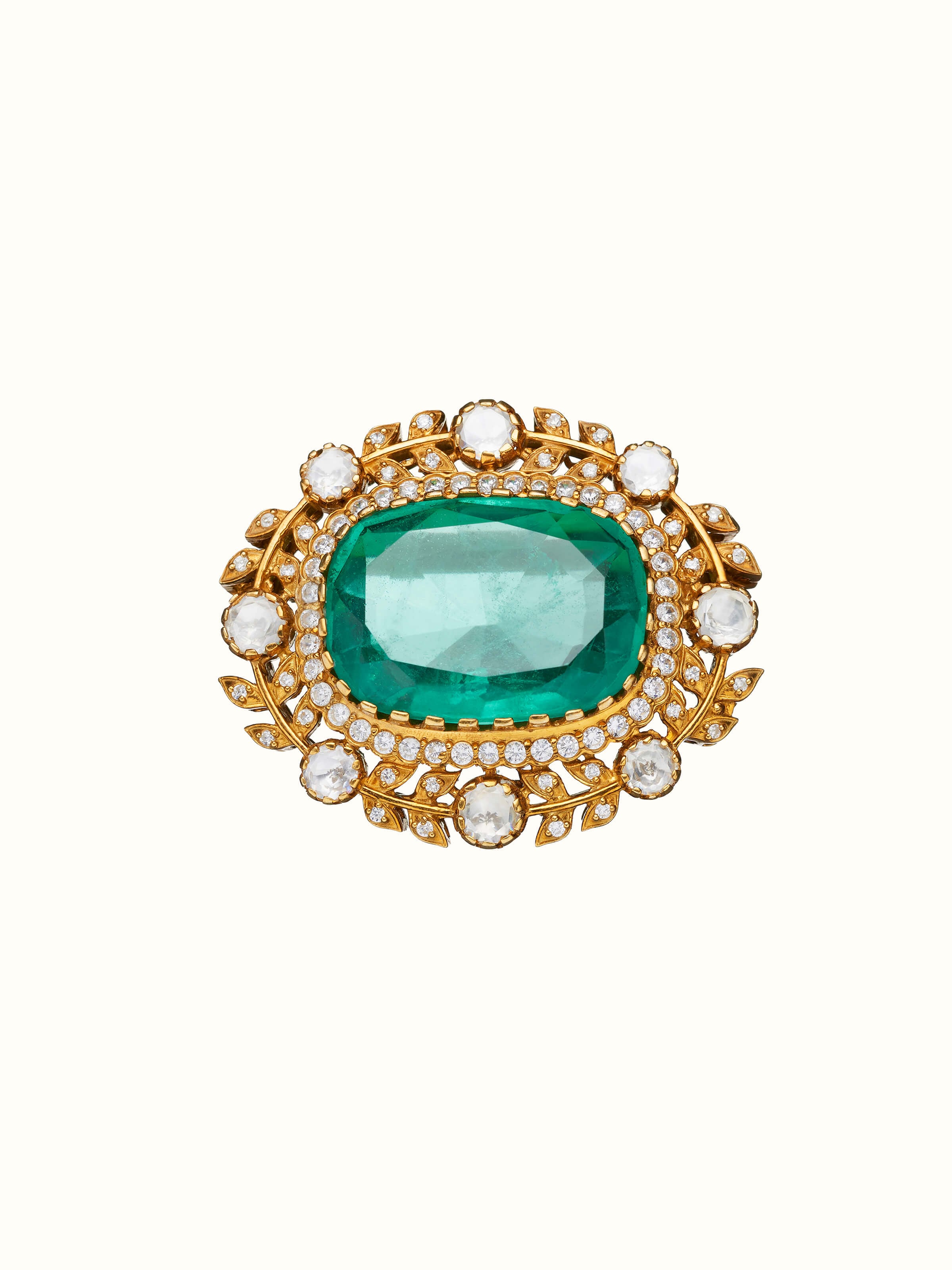 front view of silver smithing yellow gold brooch pin with intricate design