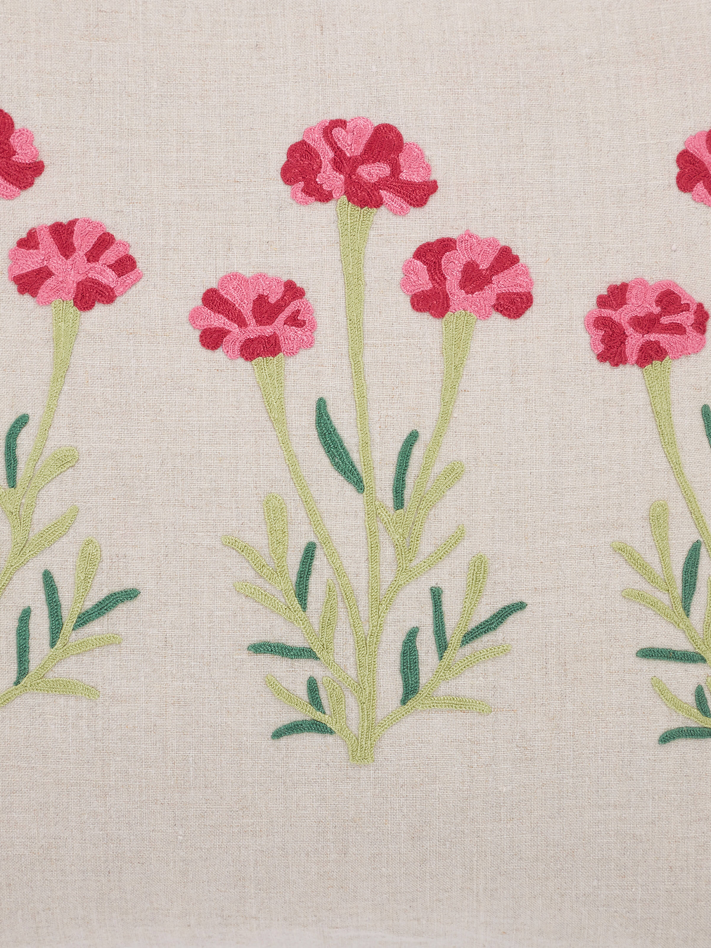 Detail shot 1: Close-up of dense chain stitch embroidery in floral Mughal design on linen fabric.