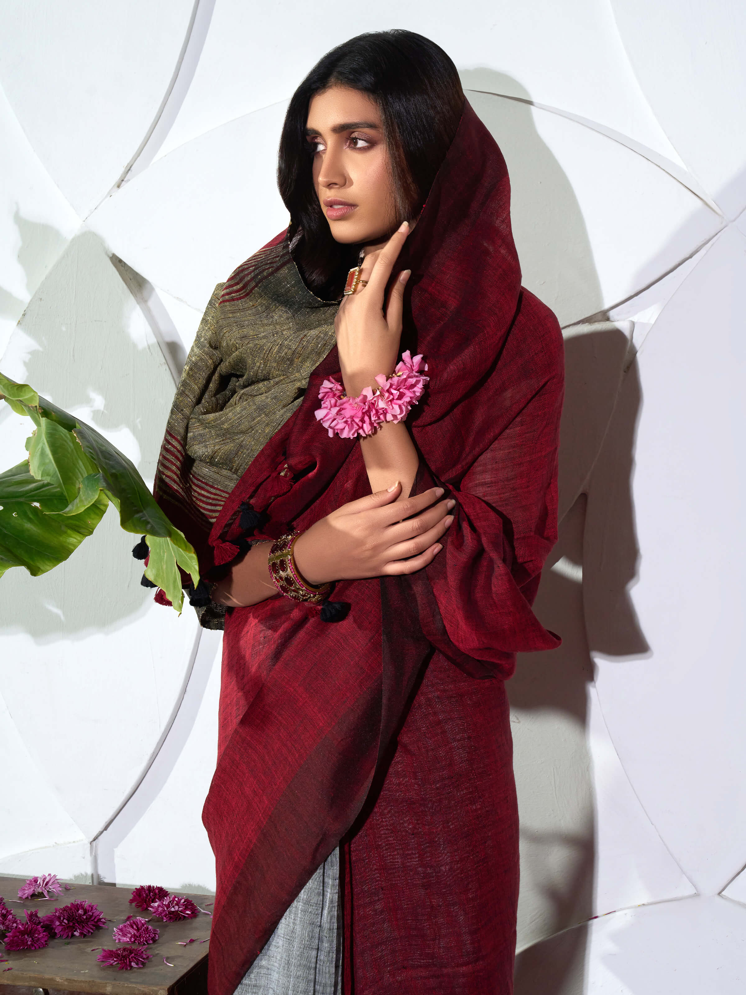 Angled view of grey linen saree highlighting fabric weave and simplicity