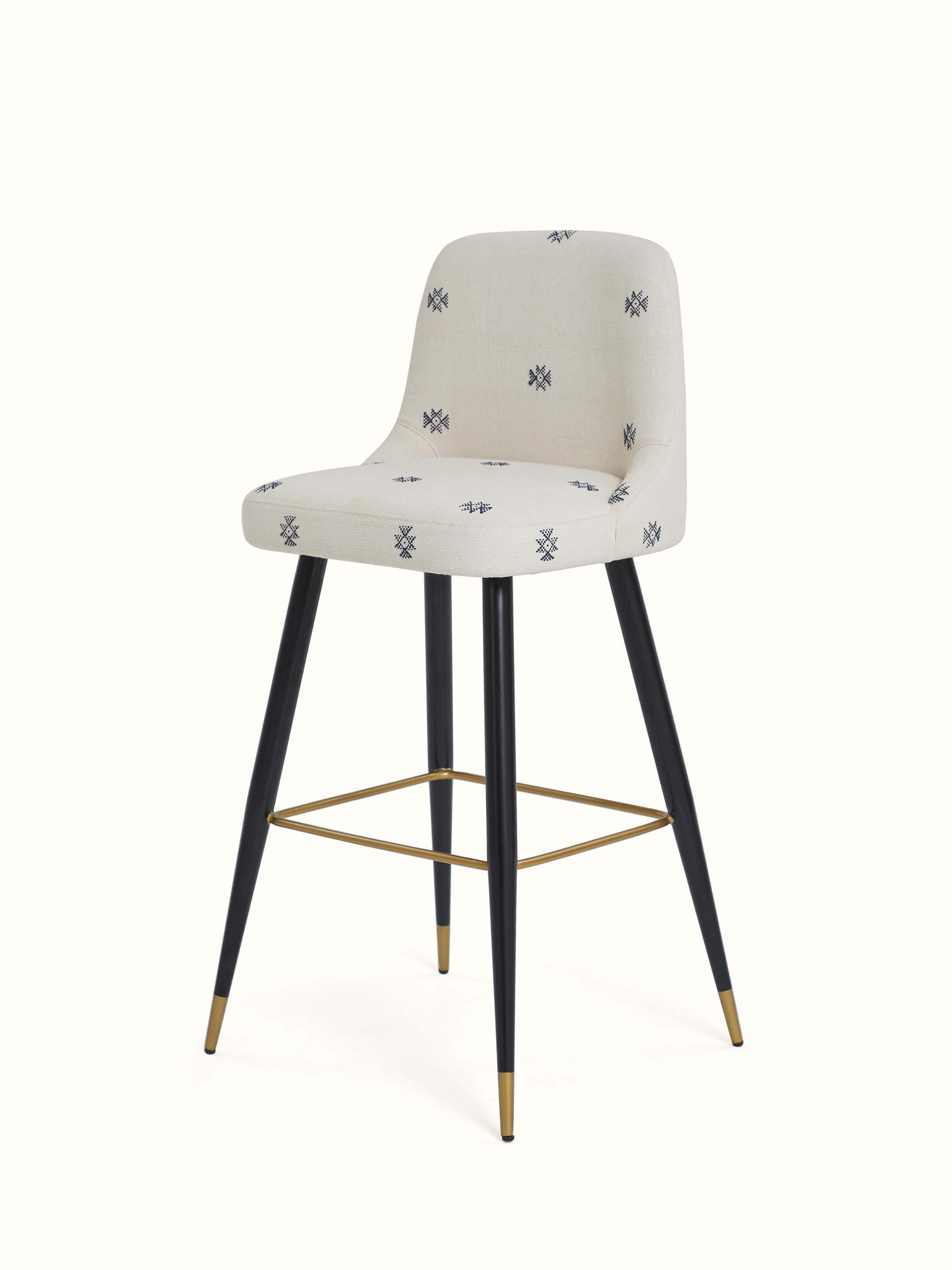 Angled view of Upholstered Metal Bar Chair displaying the plush upholstery and sleek, modern frame.