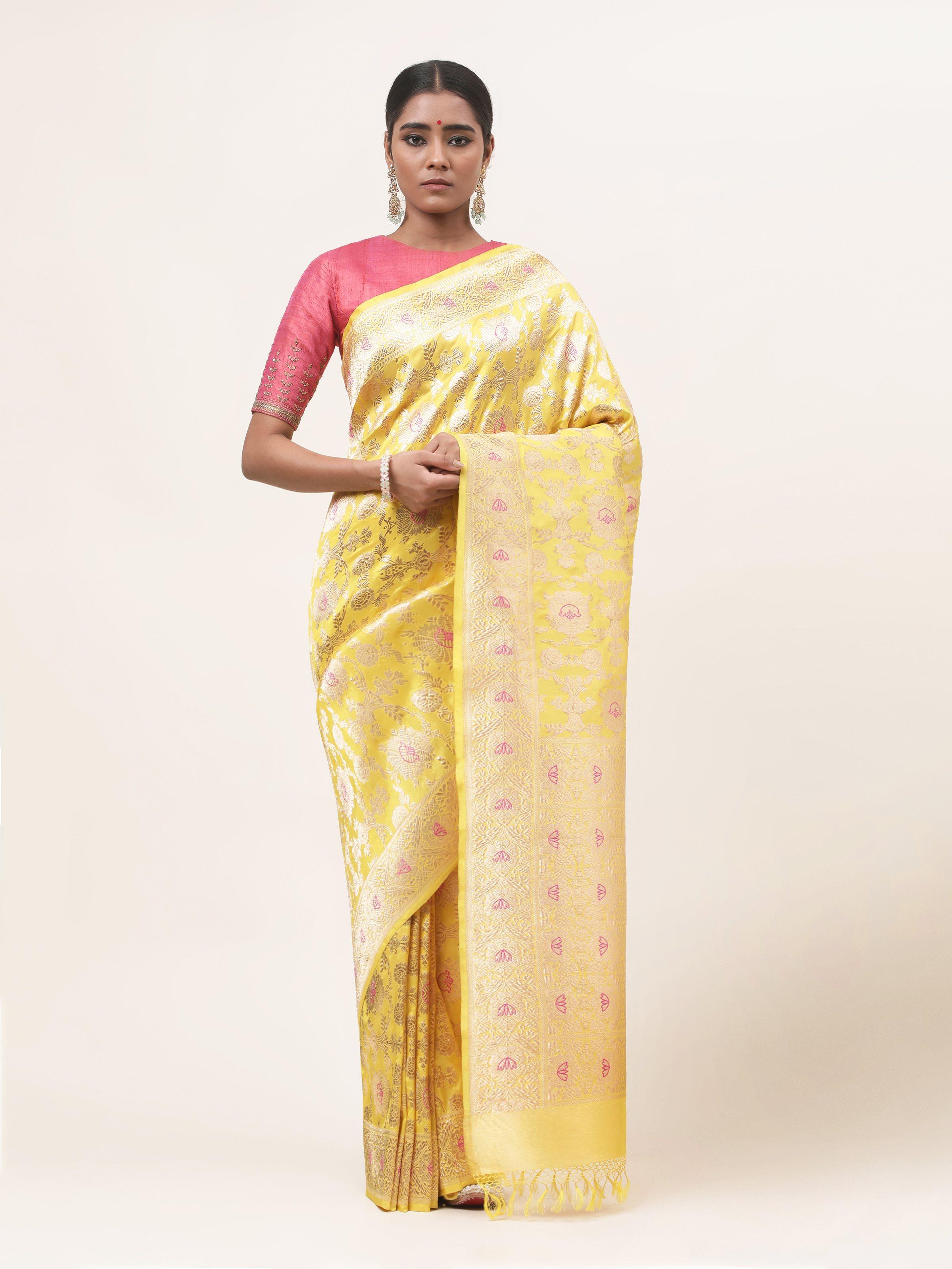 Front view of yellow mulberry Katan silk Banarasi saree with rich zari motifs