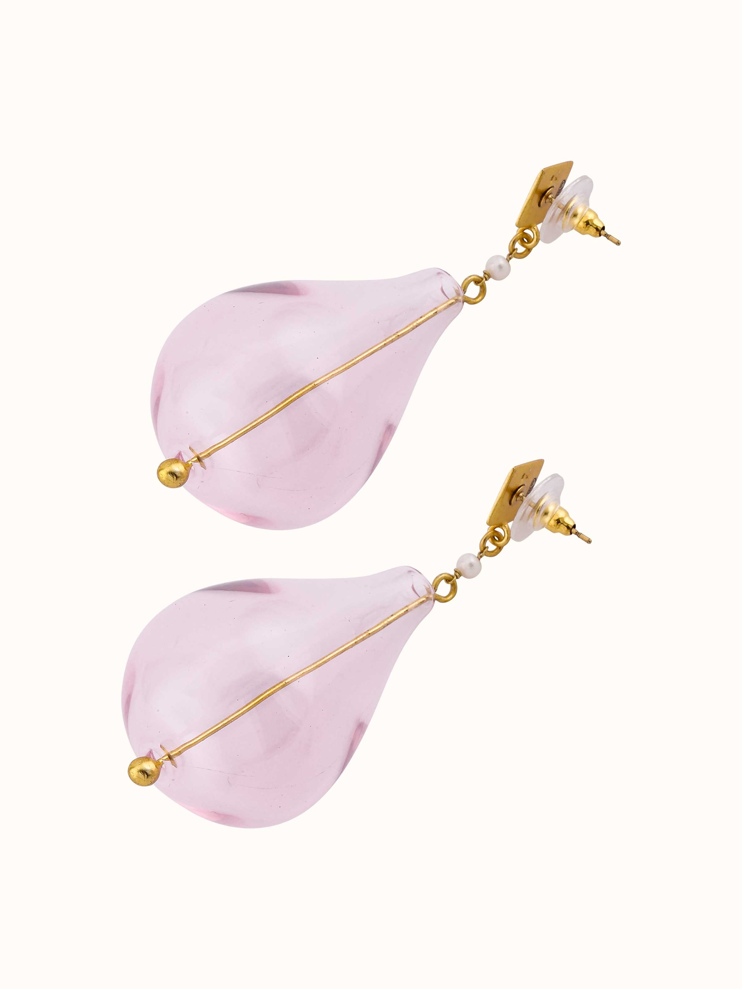 Worn view of silver flame glass drop earrings