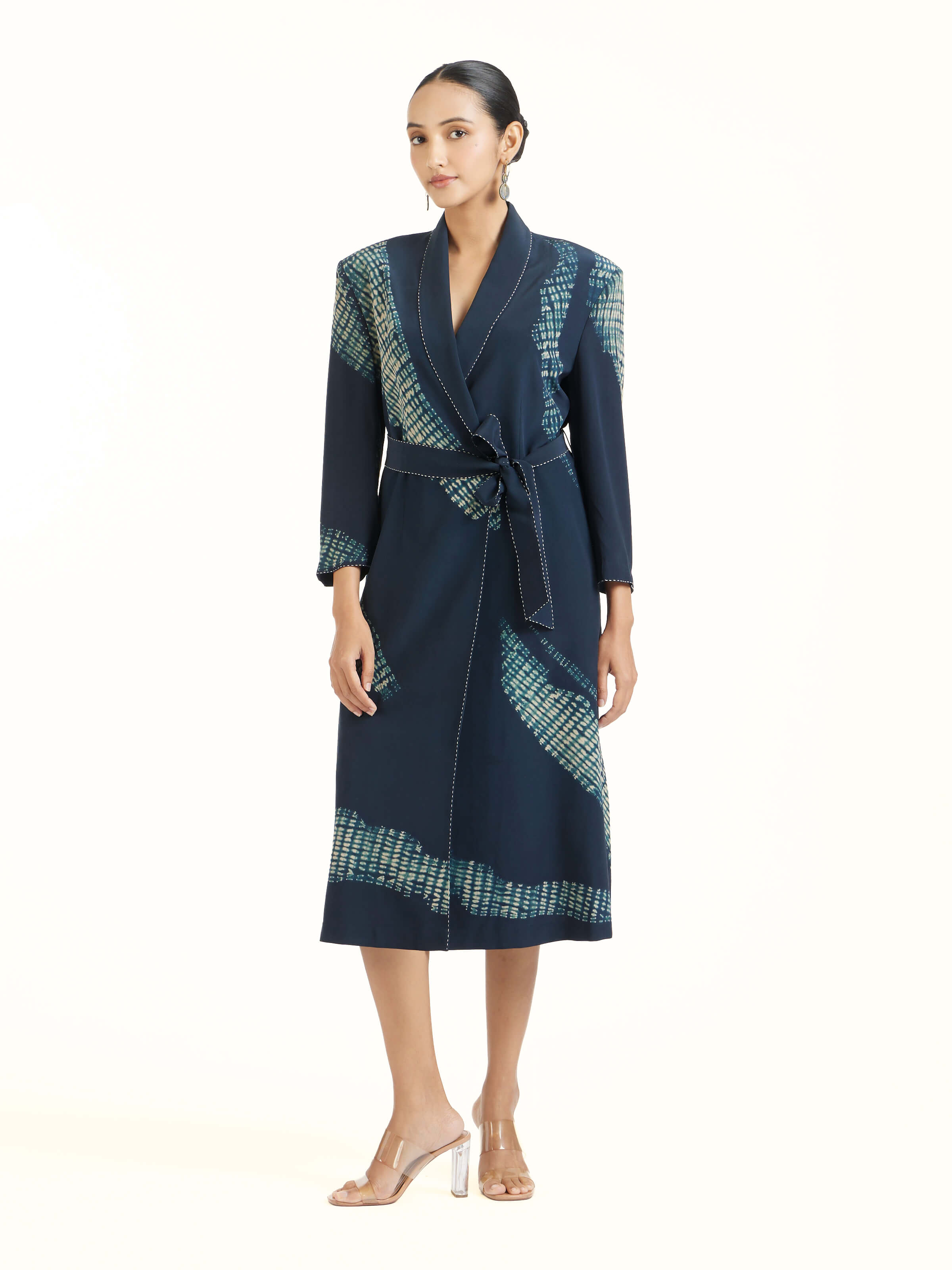 Side view of blue shibori jacket dress showcasing layered styling