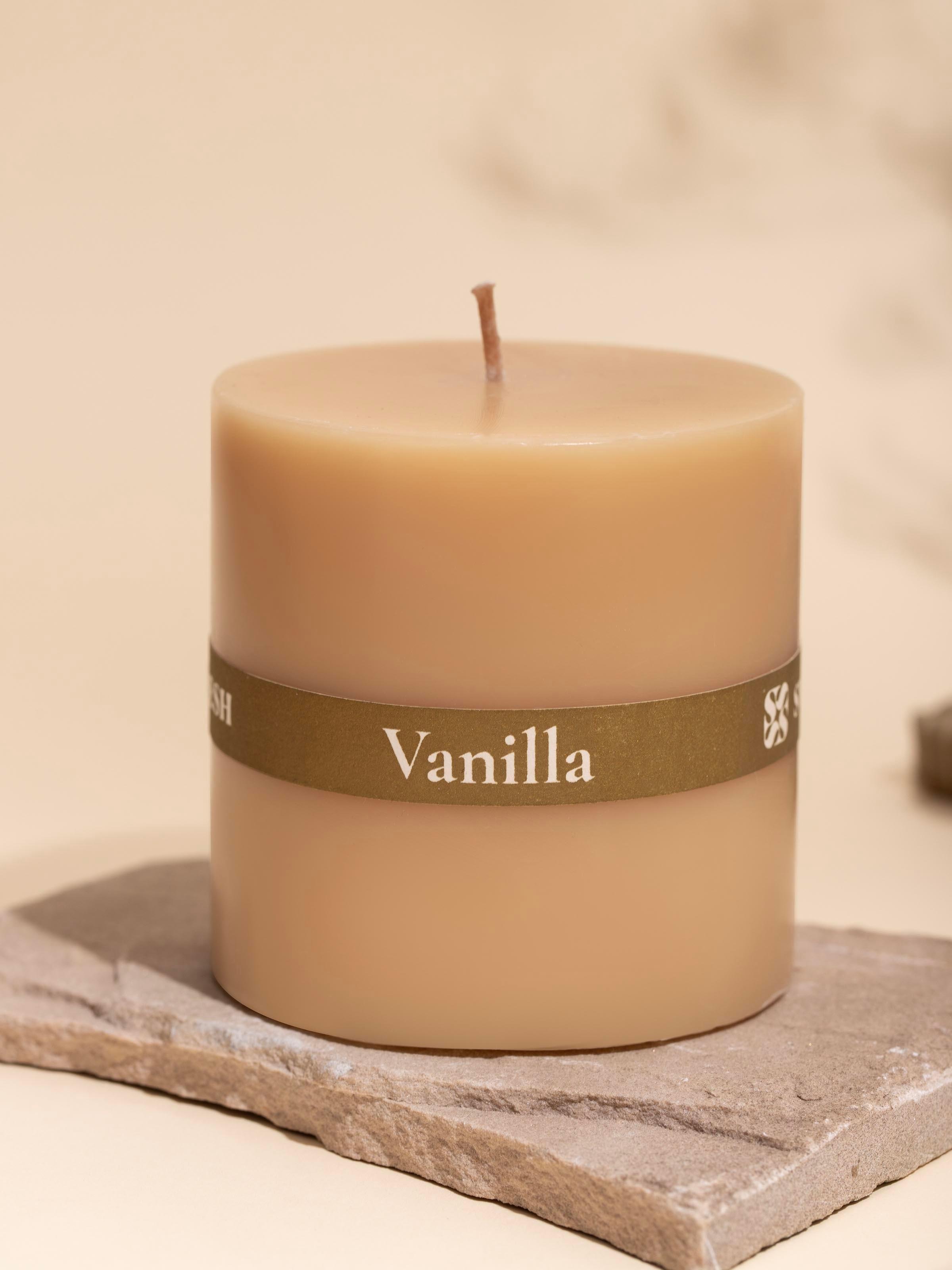 Vanilla pillar candle (3 inches) from a slightly angled perspective, focusing on the candle's shape.