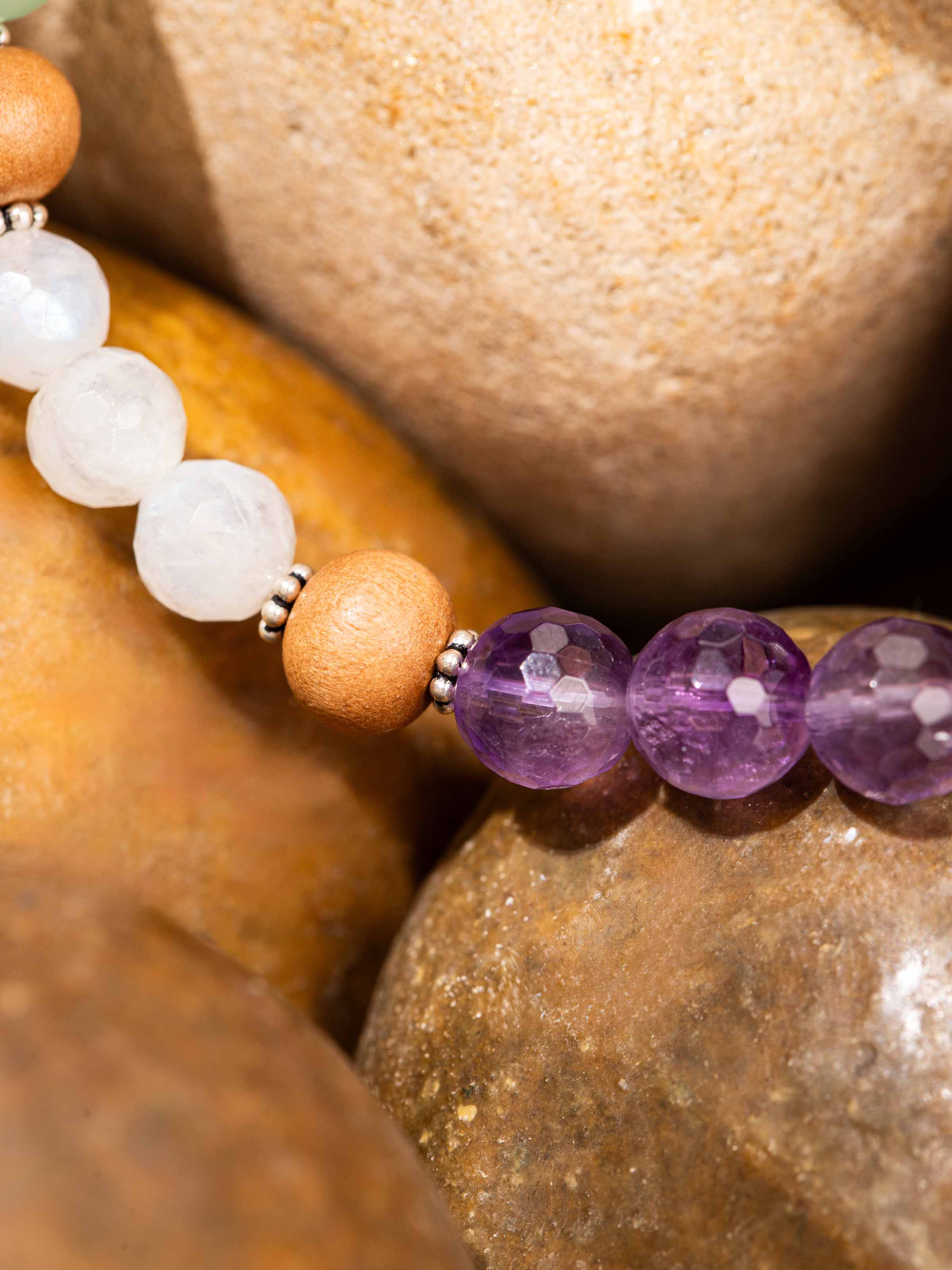 Angled view of Amethyst, Green Aventurine & White Moonstone Bracelet displaying bead alignment and lustrous finish