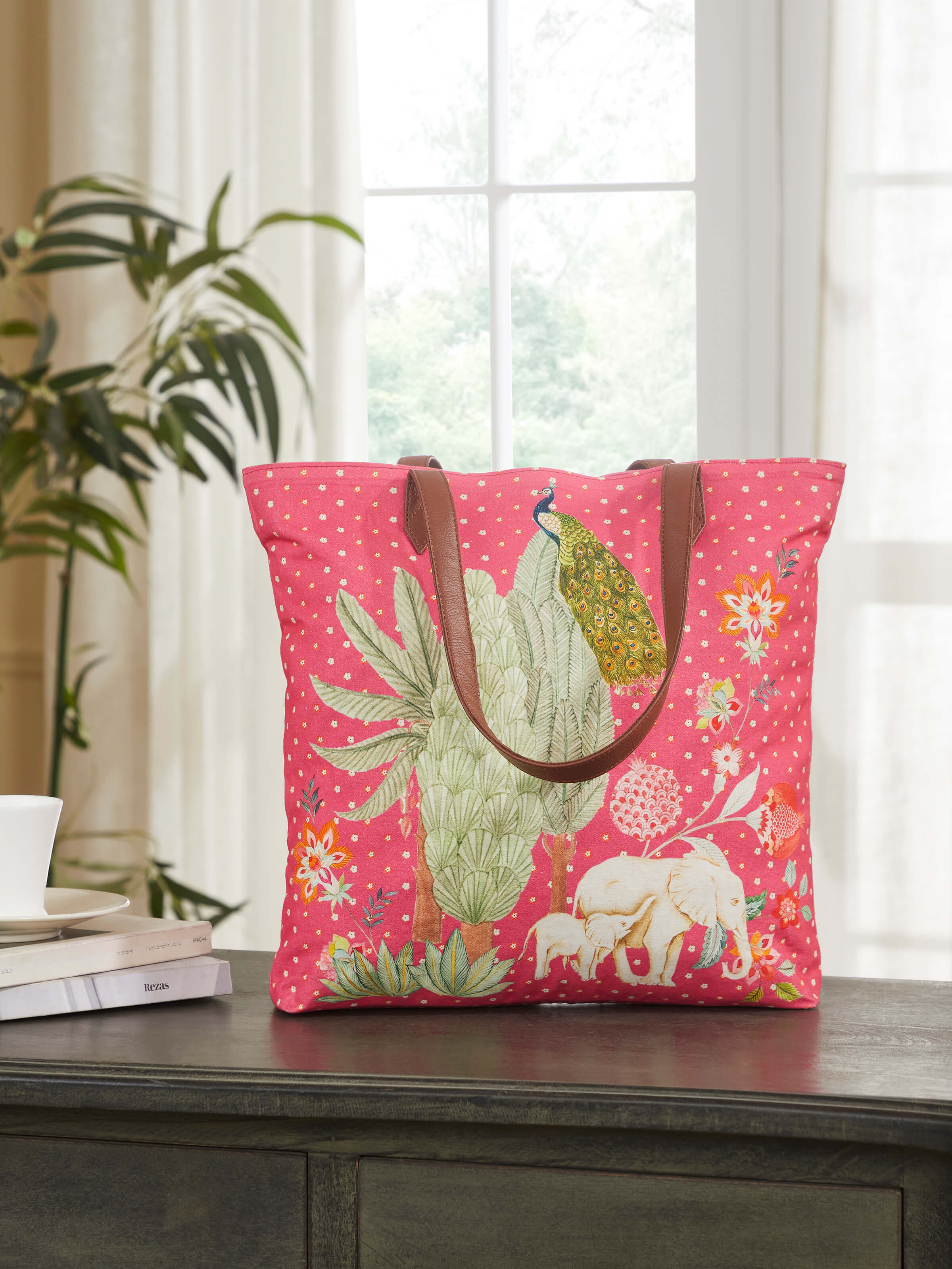 Side view of tote bag printed with design inspired by miniature artwork showing handle and depth