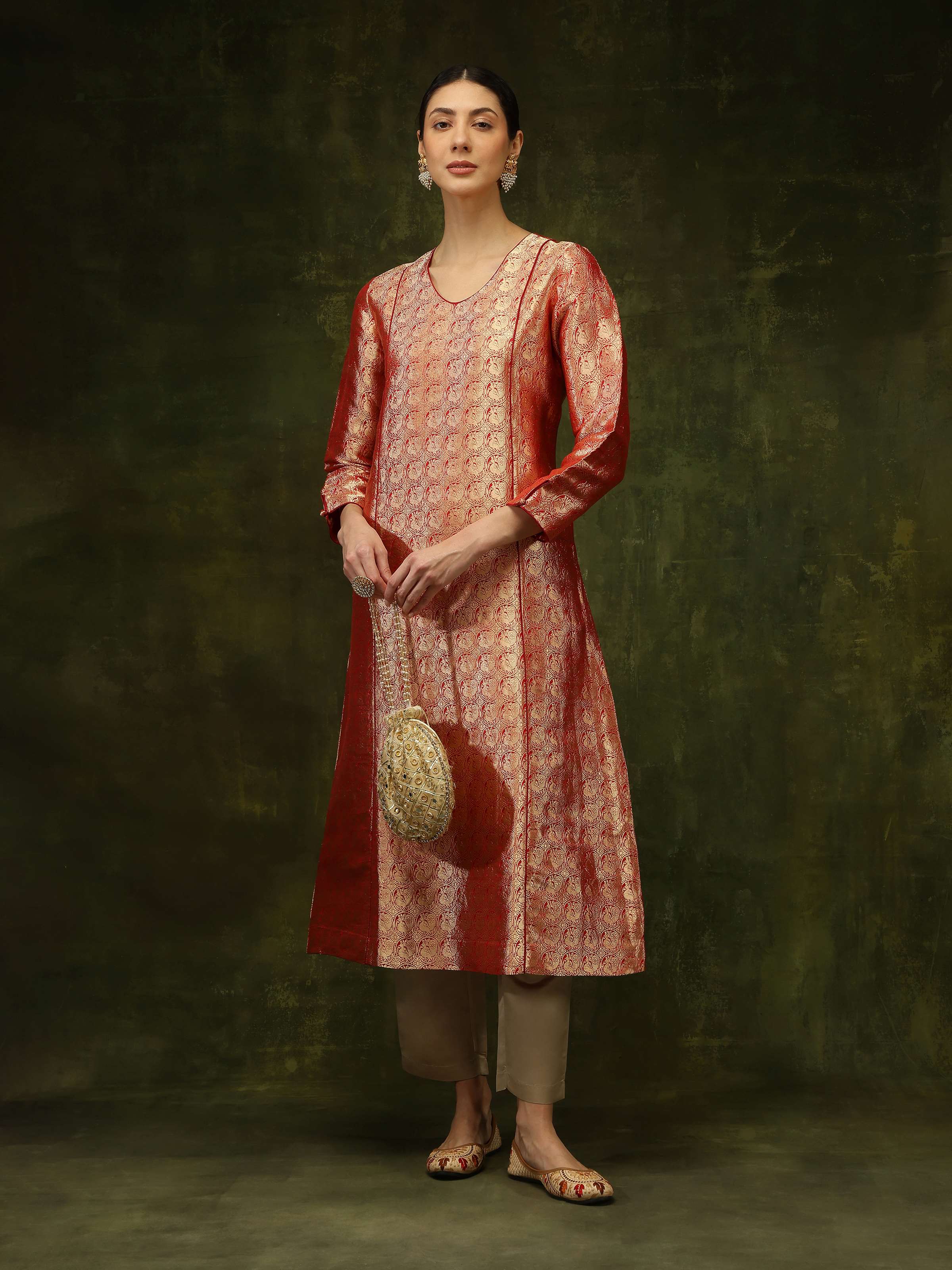 Side view of Red Banarasi Silk Kurta highlighting its glossy texture and intricate zari motifs.