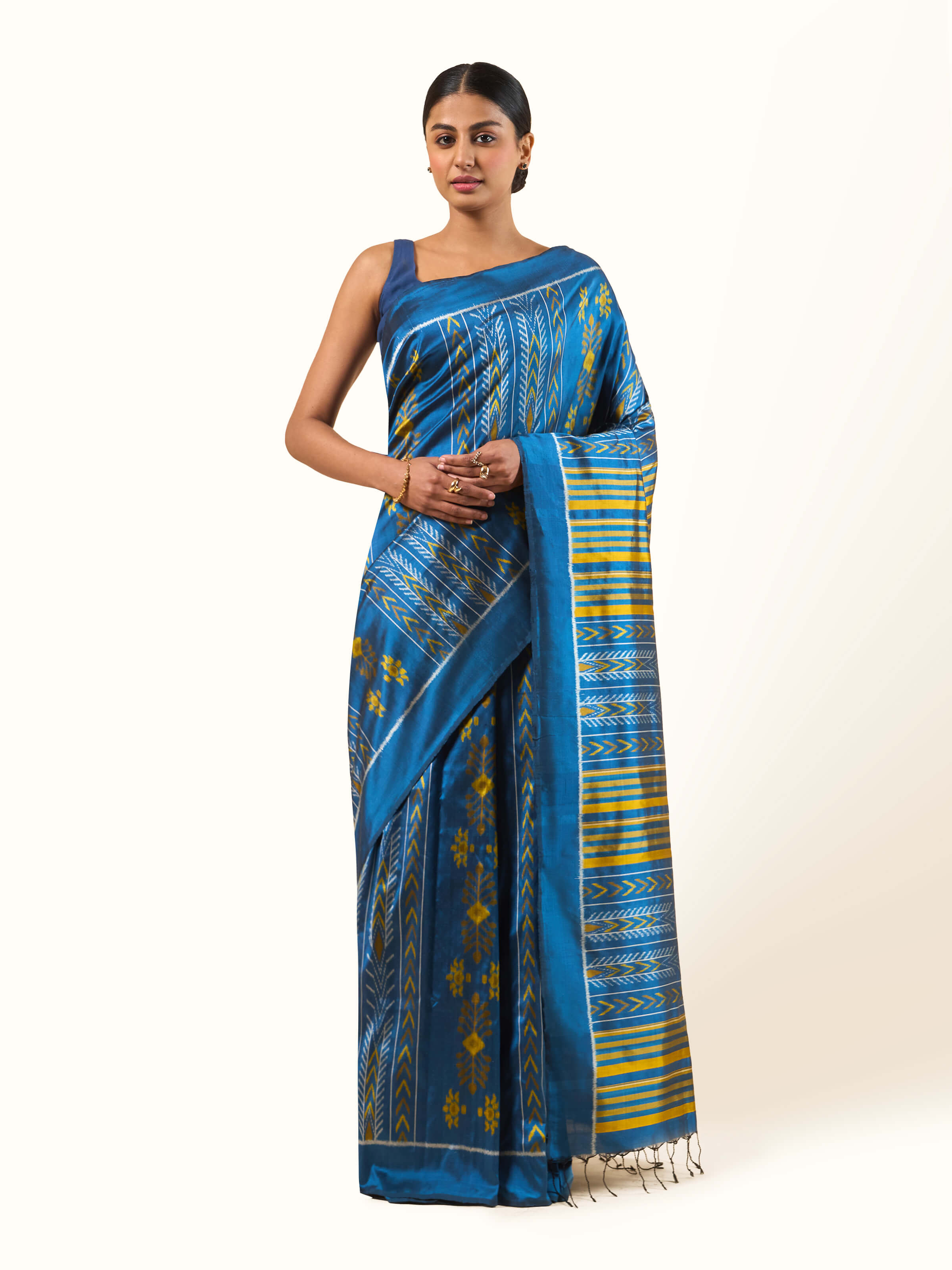 Front view of Blue Mulberry Silk Odisha Ikat Saree highlighting intricate ikat patterns.