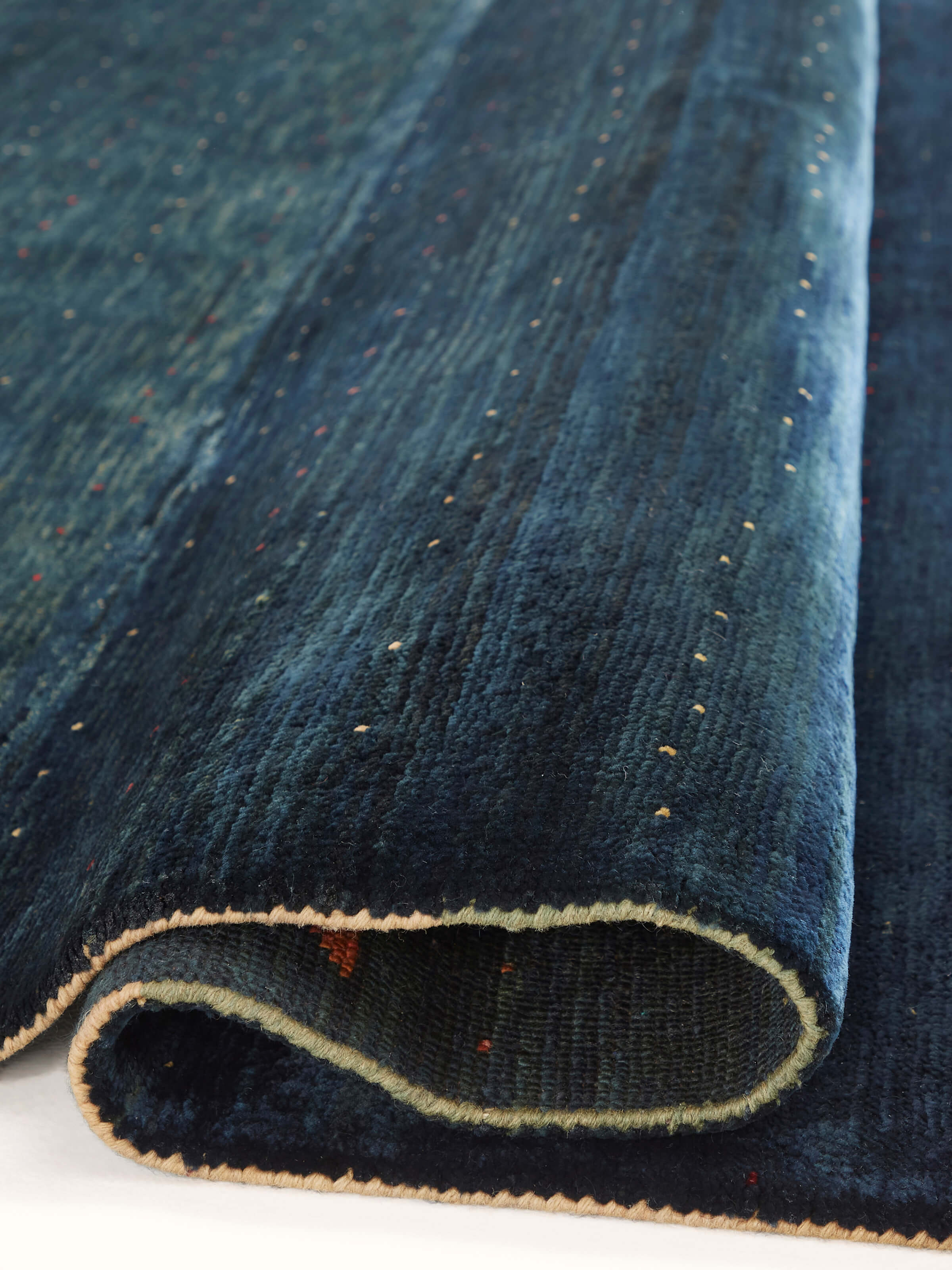 Close-up of the Traditional Gabbeh blue Jaipur wool hand-knotted carpet, capturing the intricate pattern.