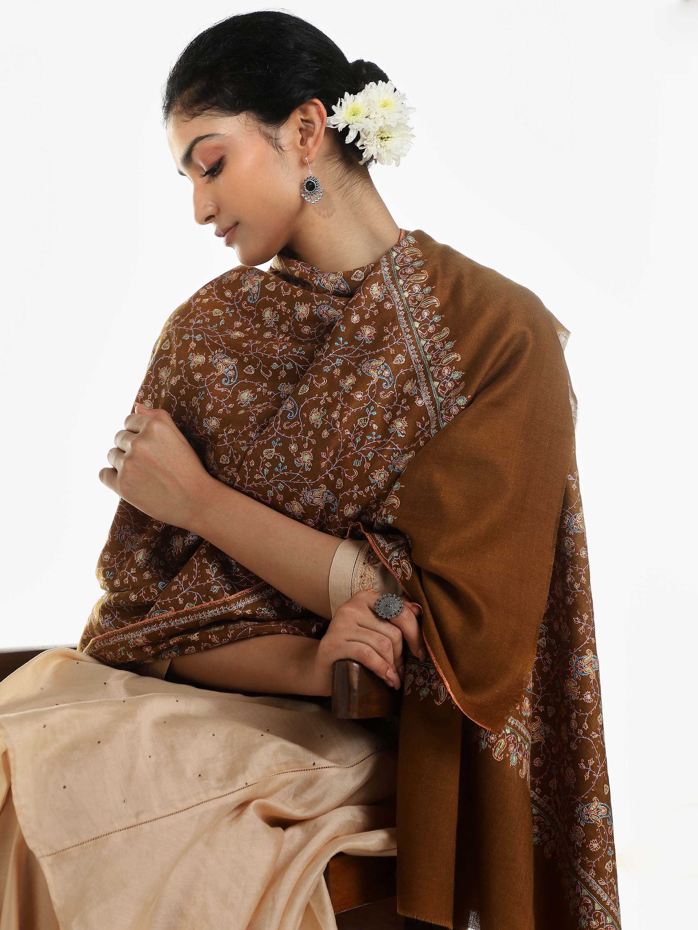Angled view of brown neemjali sozni embroidered shawl highlighting sozni patterns