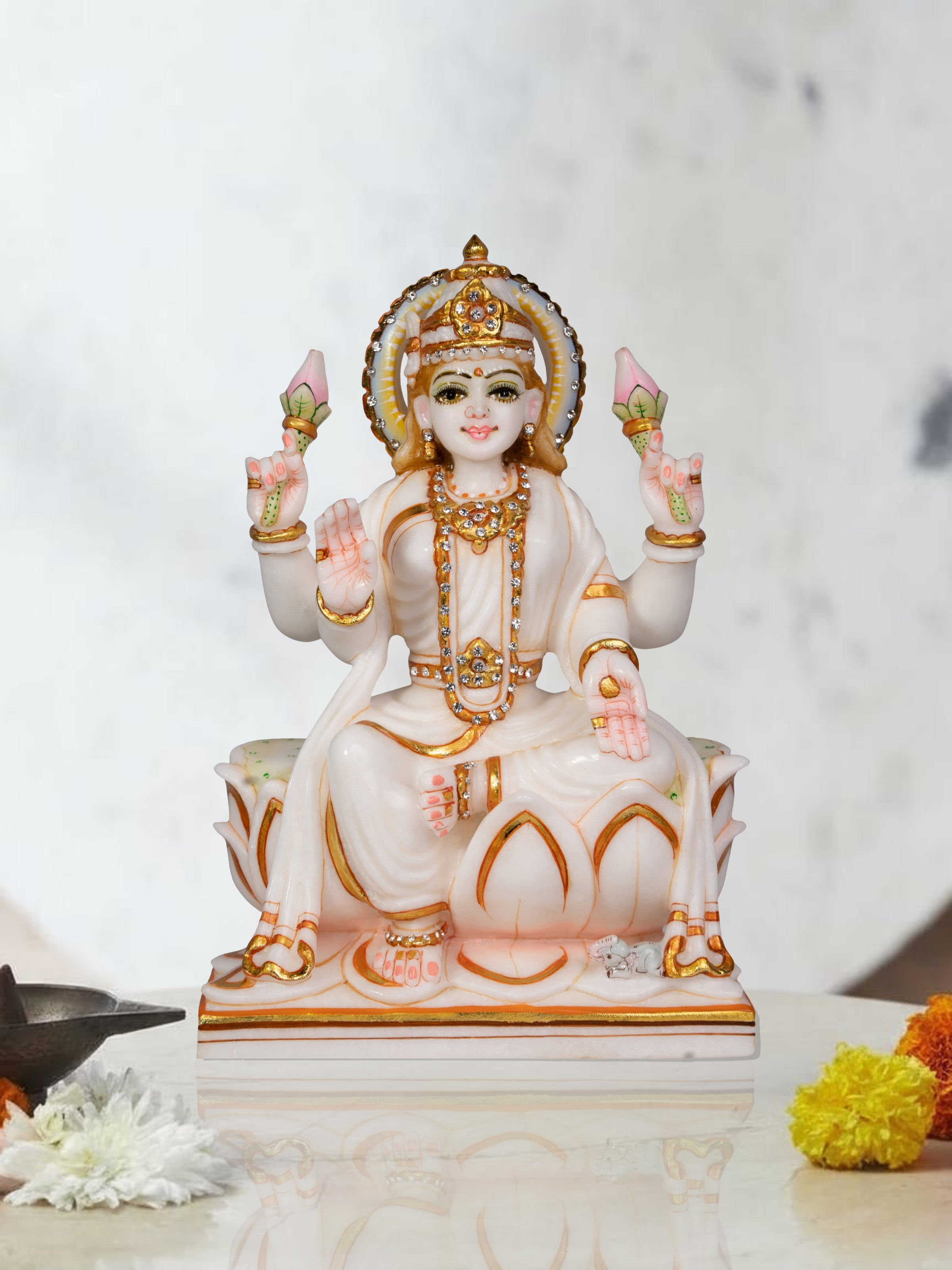 Lifestyle view of carved marble Lakshmi idol traditional home temple decor
