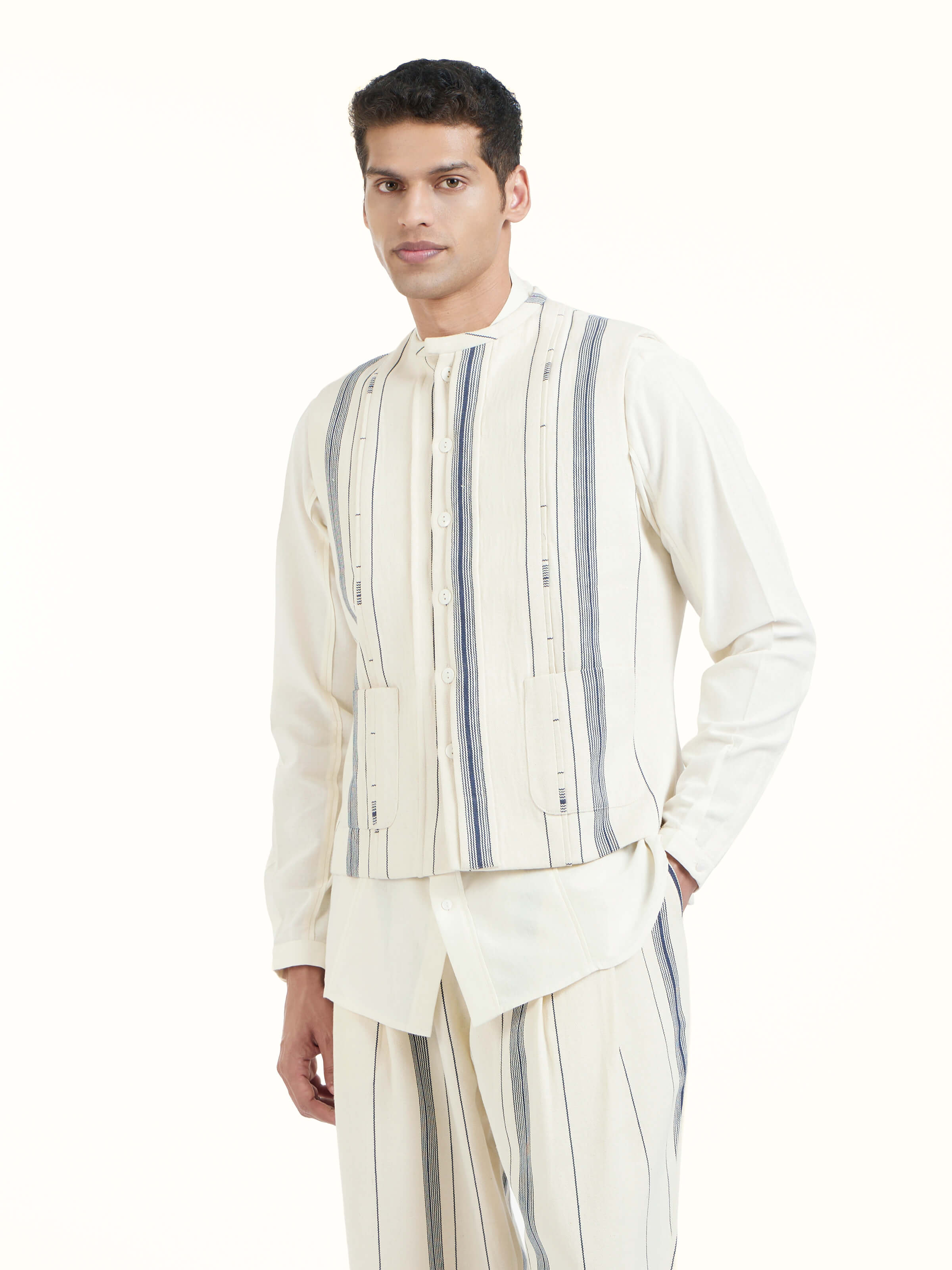 Angled view of ivory cotton handloom sleeveless jacket emphasizing fabric weave