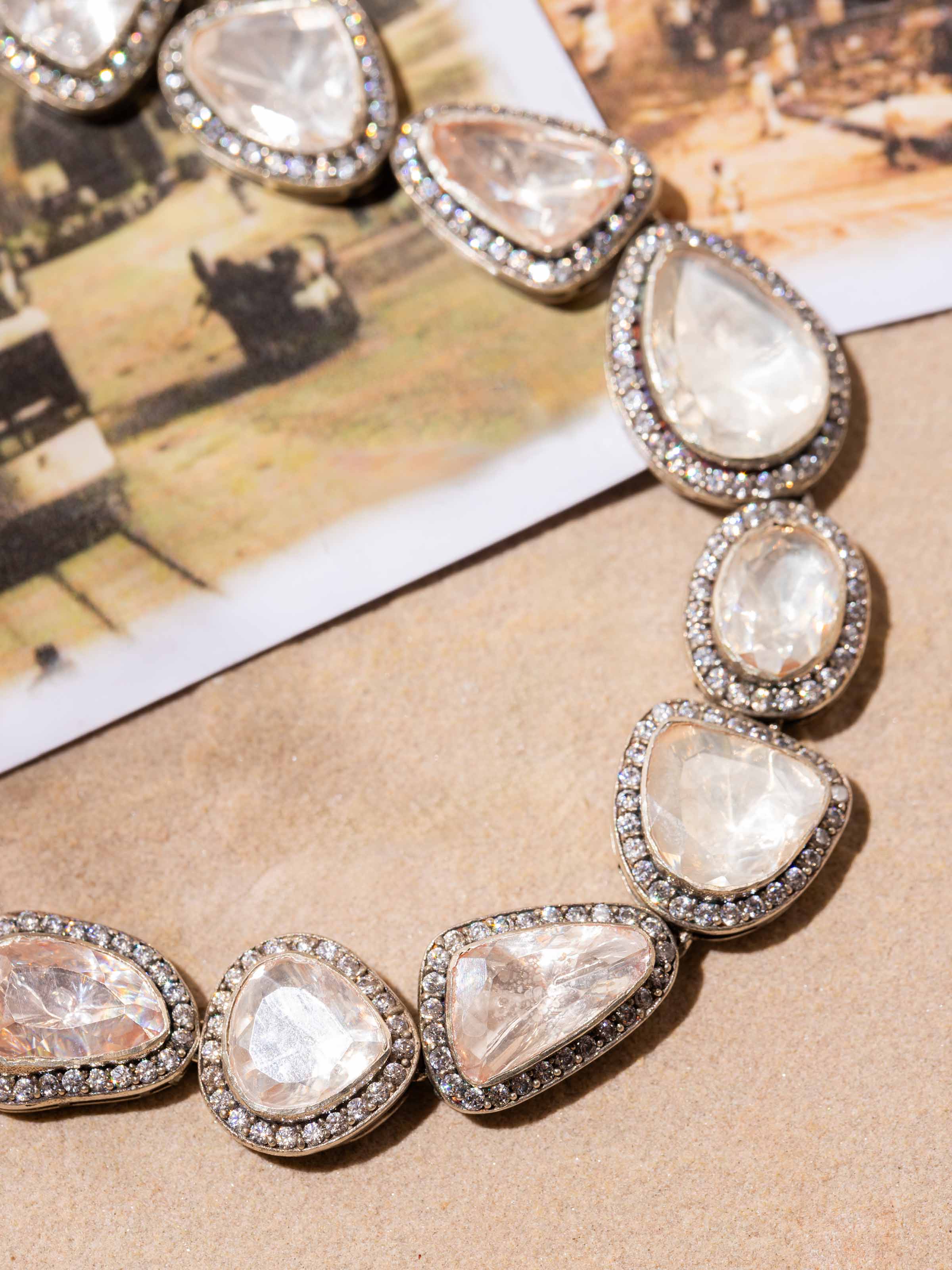 Overhead view of Silver Smithing Collar Necklace by Swadesh highlighting the refined curves and smooth silver finish