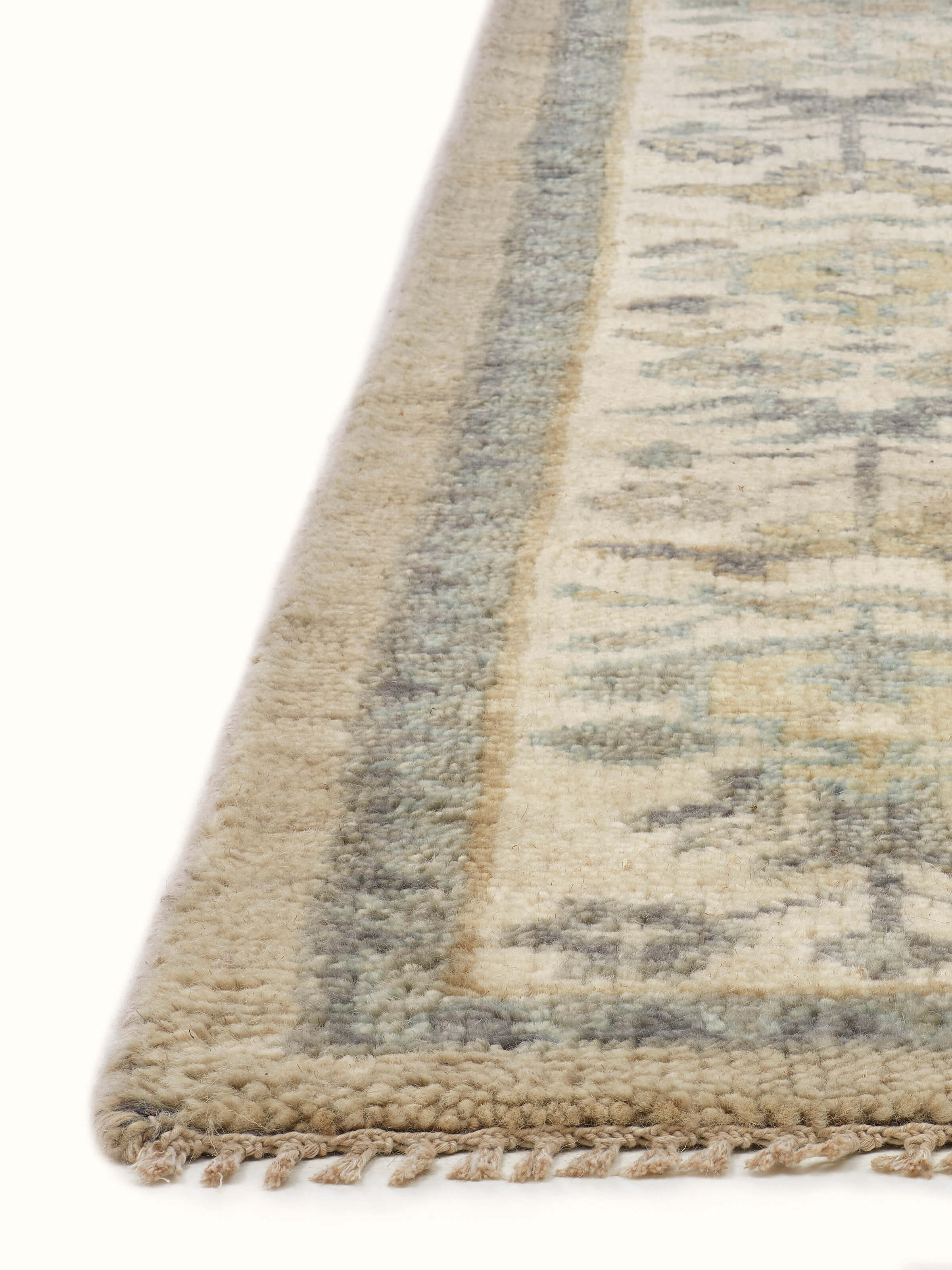 Front view capturing the subtle blend of grey and green tones with detailed craftsmanship