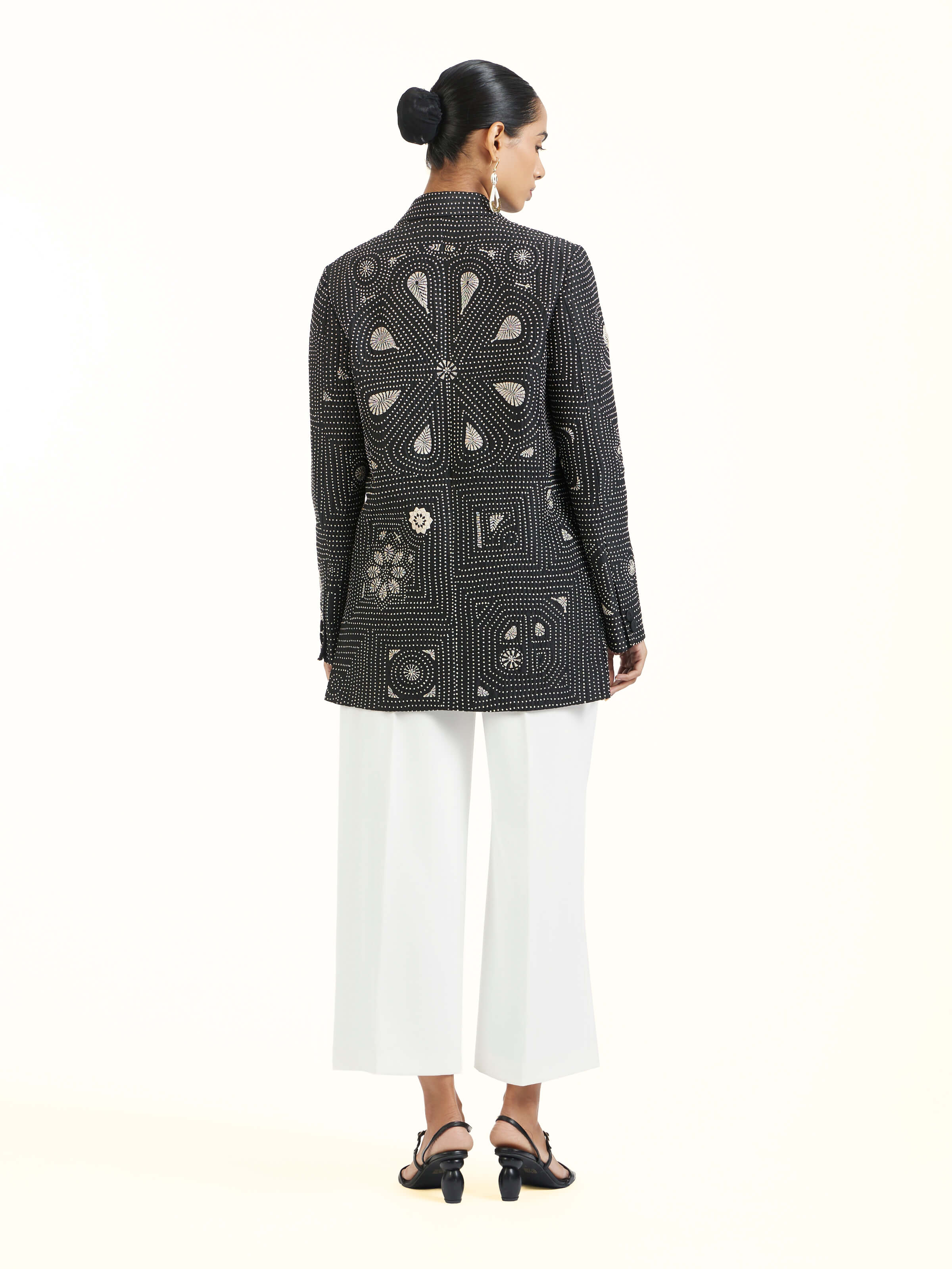 Back view of black silk kantha jacket displaying overall design
