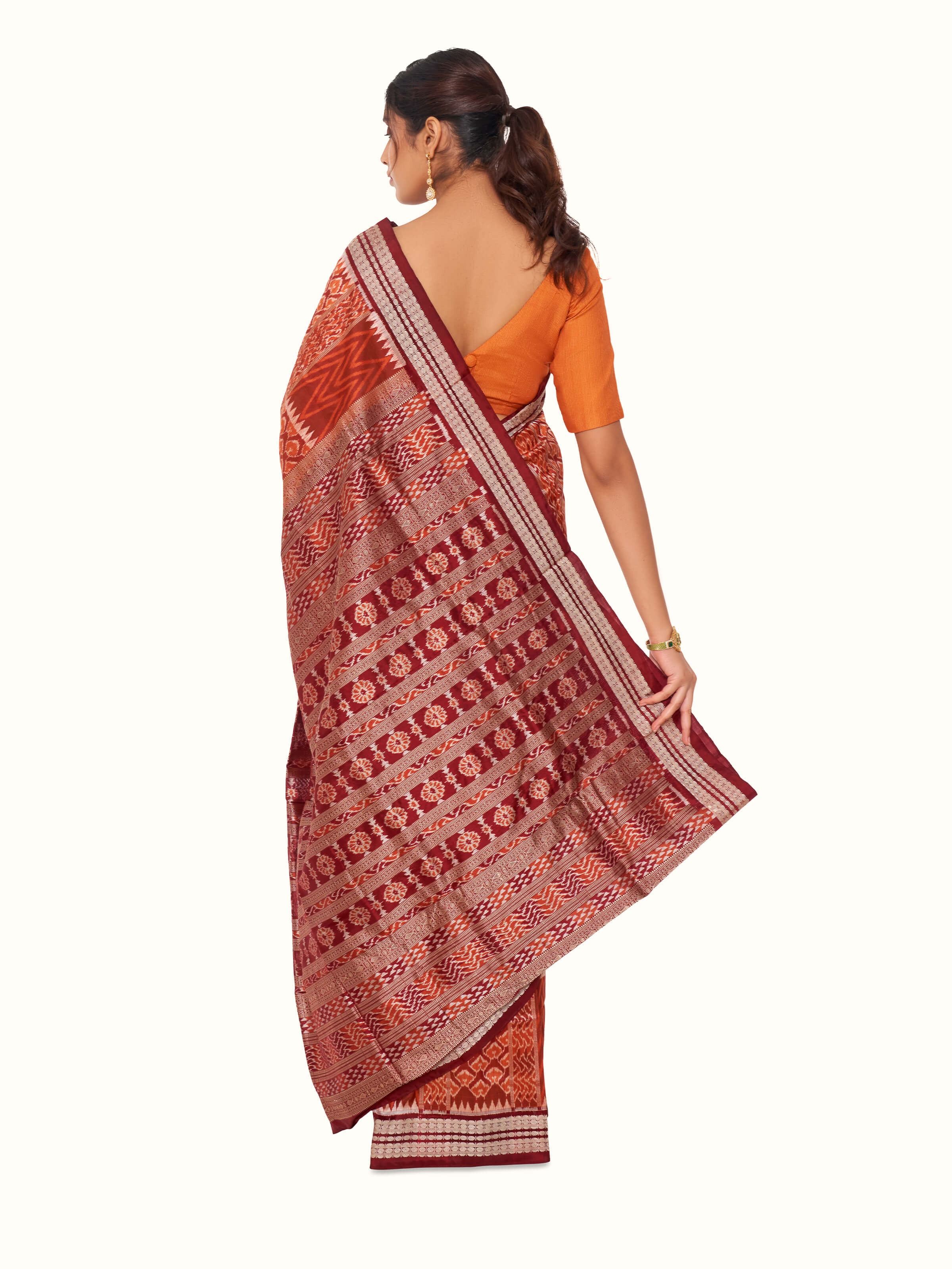 Back view of brown mulberry silk bandha Odisha saree displaying full design