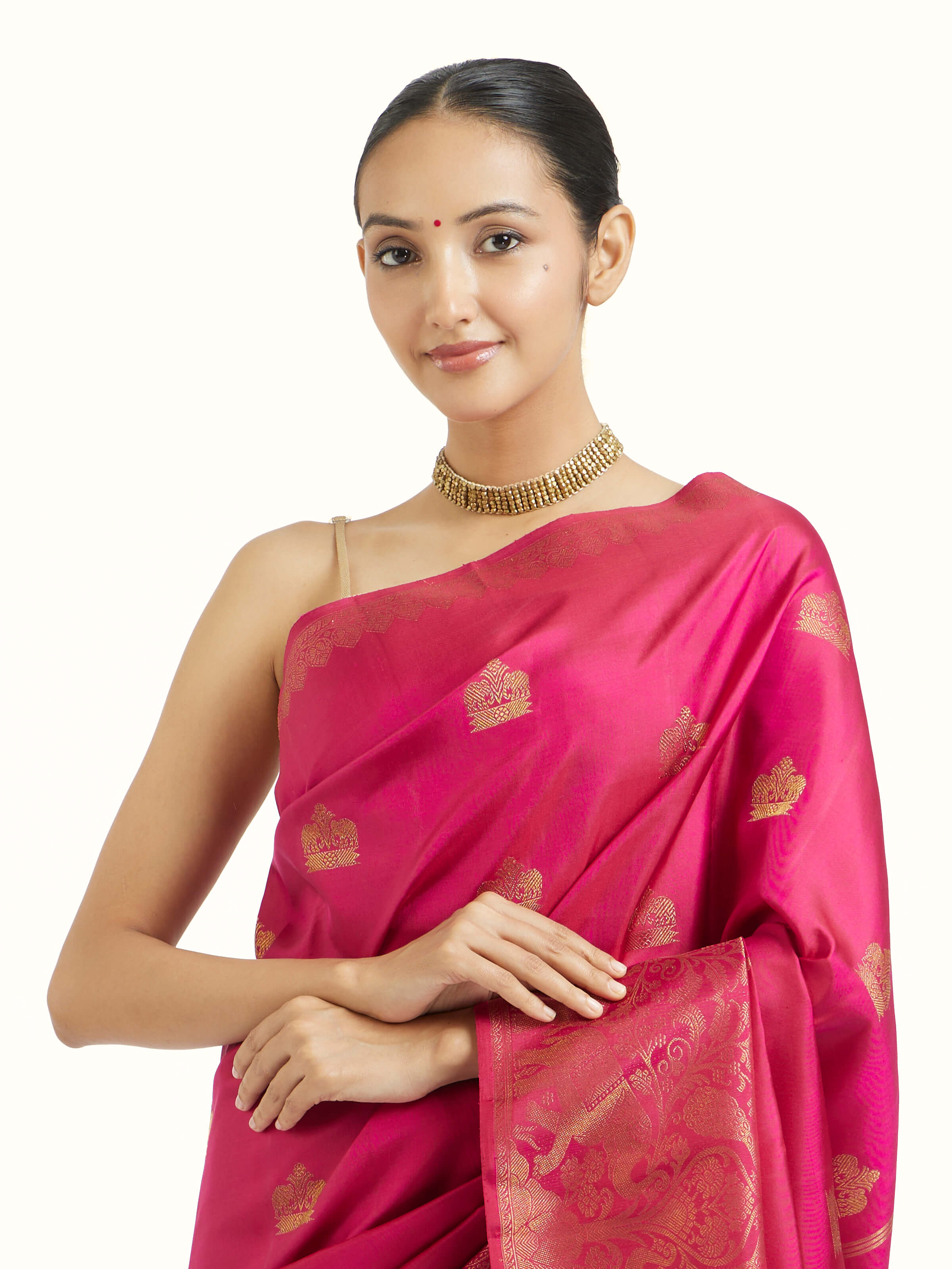Angled view of red silk Kancheepuram saree emphasizing traditional weave and pallu detailing