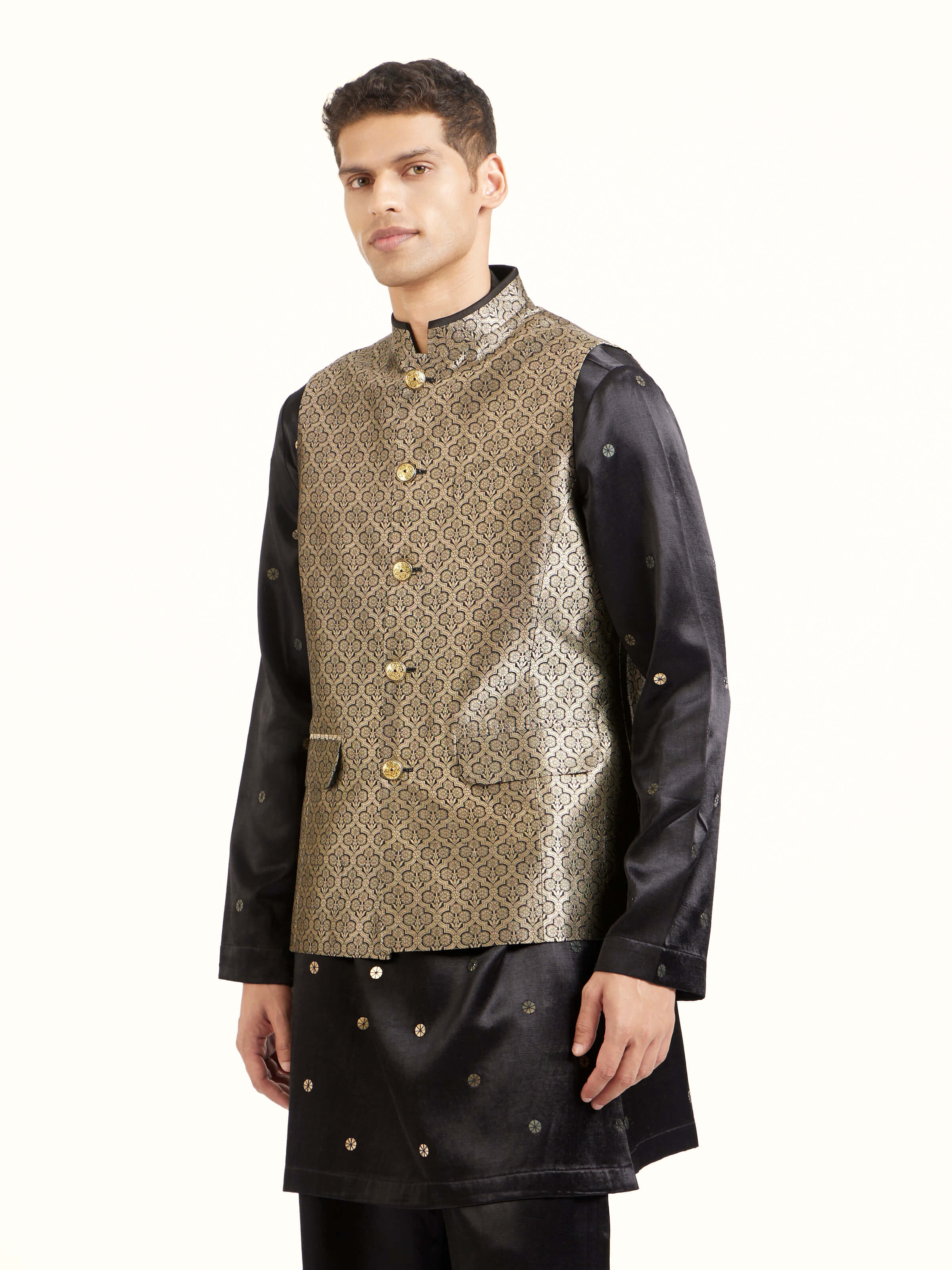 Angled view of black silk Banarasi sleeveless jacket highlighting woven patterns