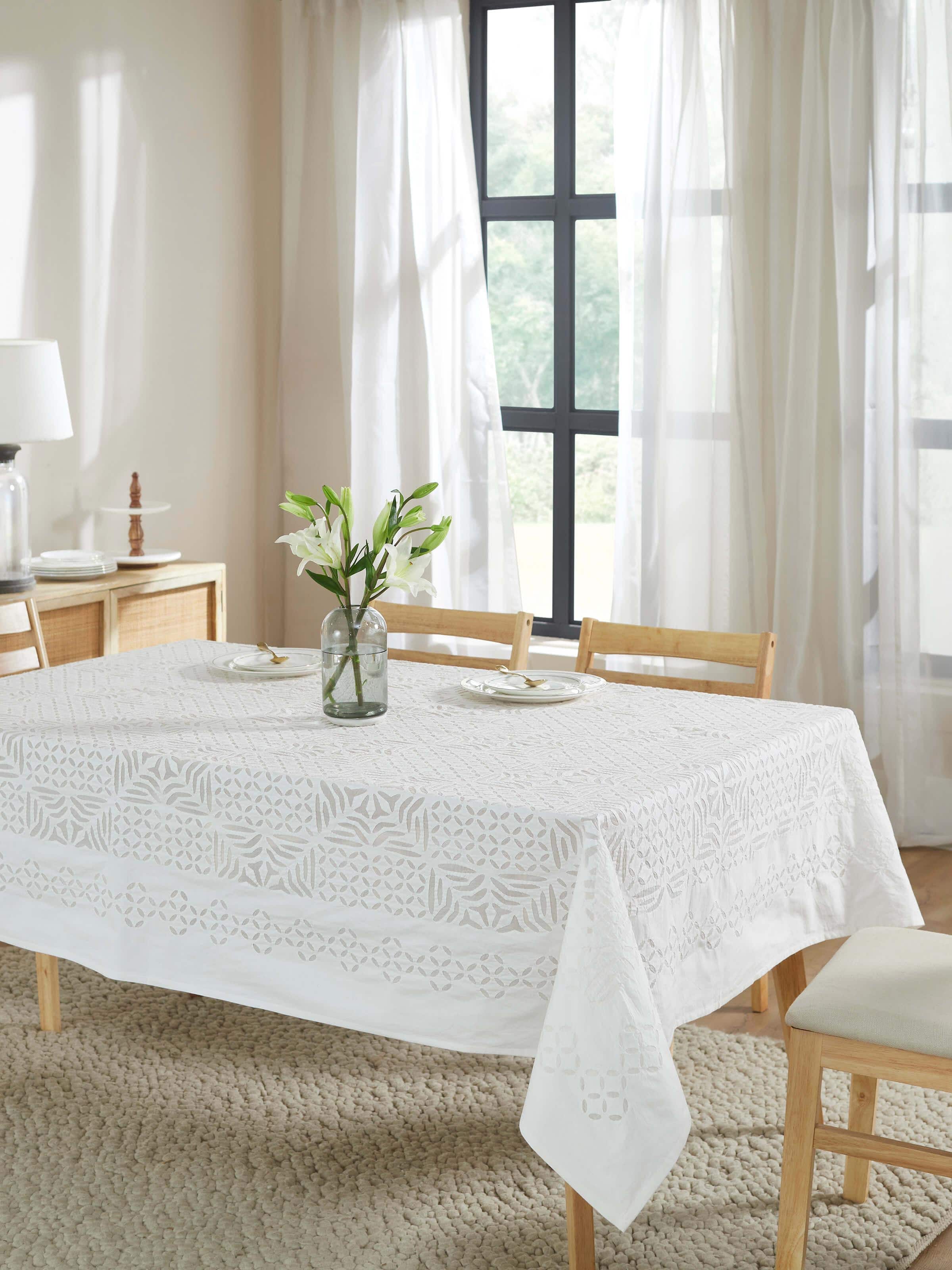 Lifestyle image displaying the table cover in a styled dining room setting