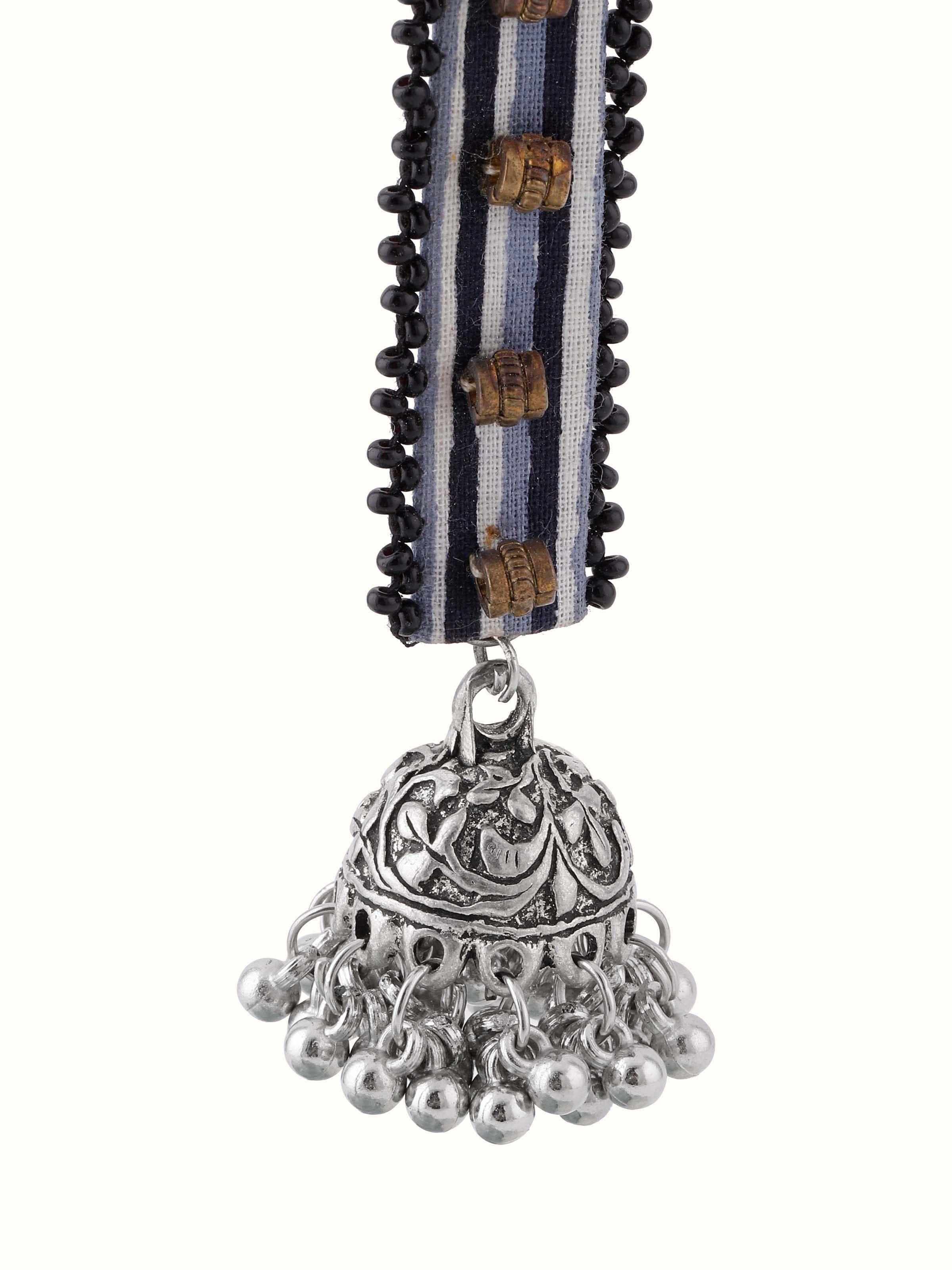 Close-up view of Ajrakh Drop Earrings featuring elaborate designs by Swadesh