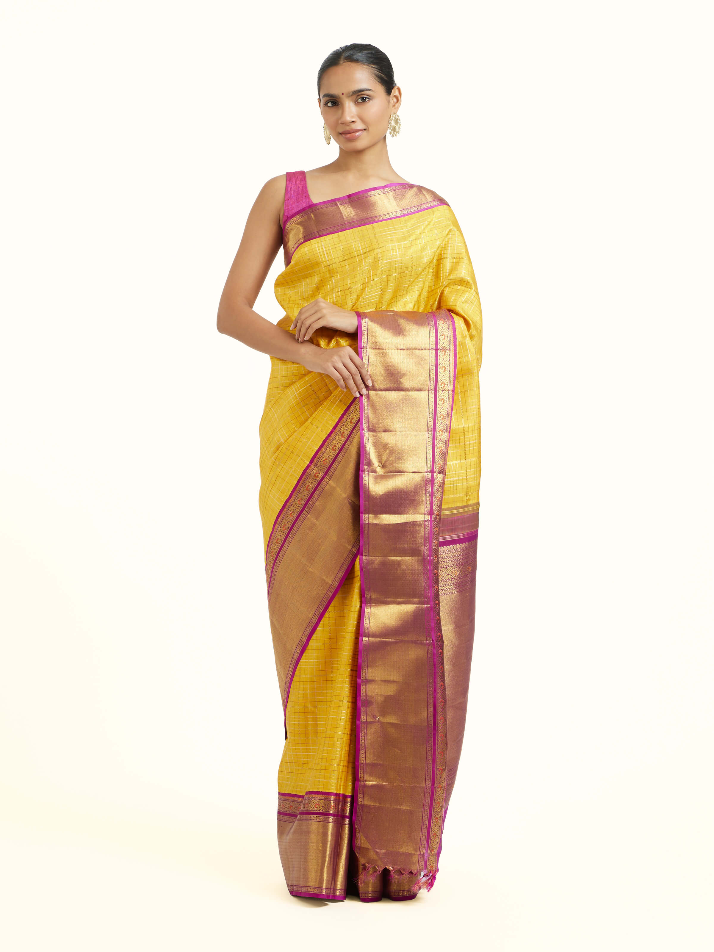 Front view of yellow silk Kancheepuram saree with rich zari motifs