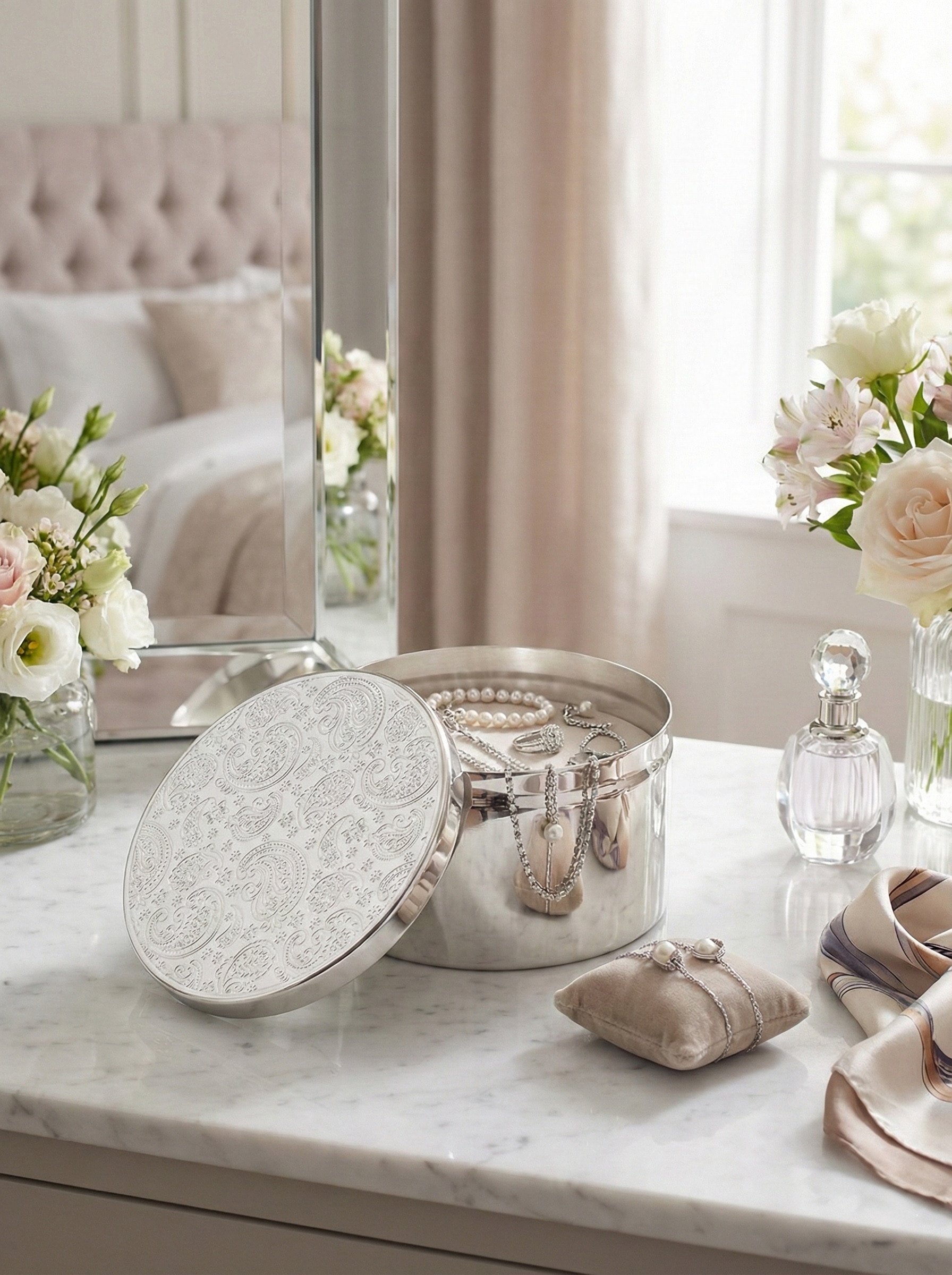 Silver-plated paisley round decorative box with embossed floral pattern