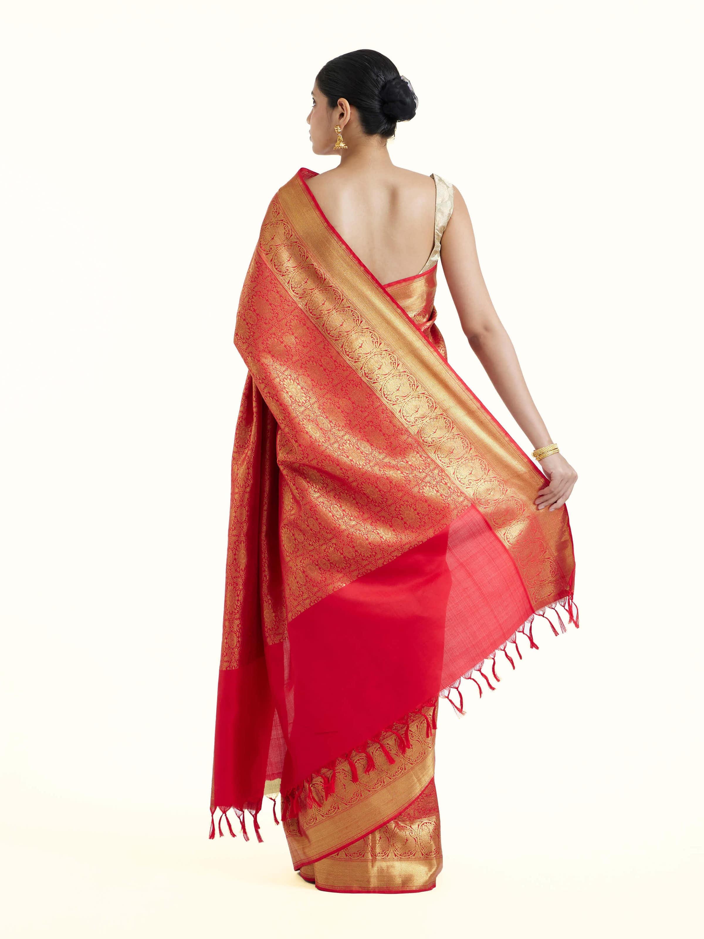 Back view of pink silk Kancheepuram saree displaying ornate pallu design