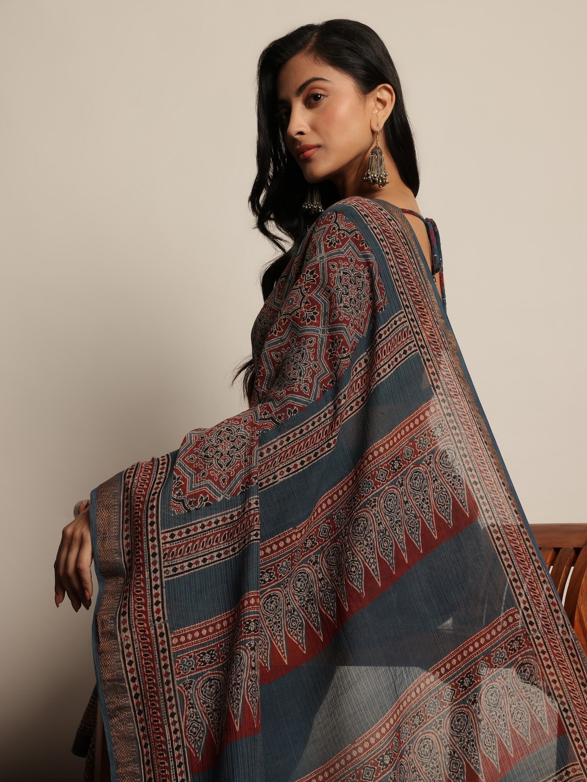 Detailed close-up of blue Maheshwari saree showcasing block print motifs.