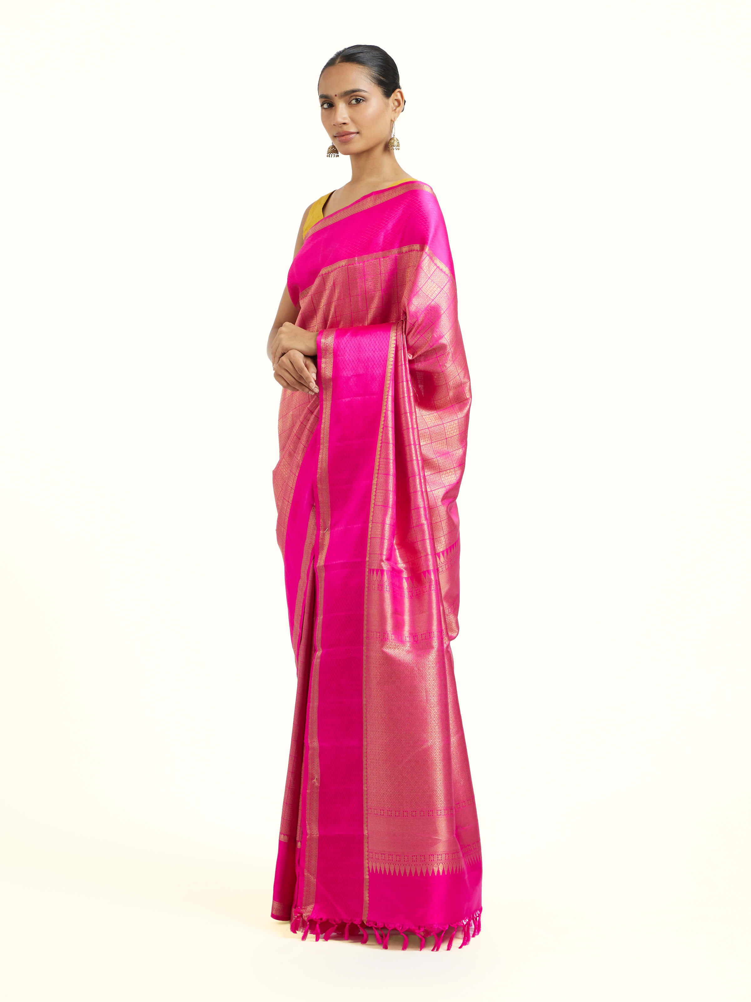Side view of pink silk Kancheepuram saree with graceful drape and contrast border