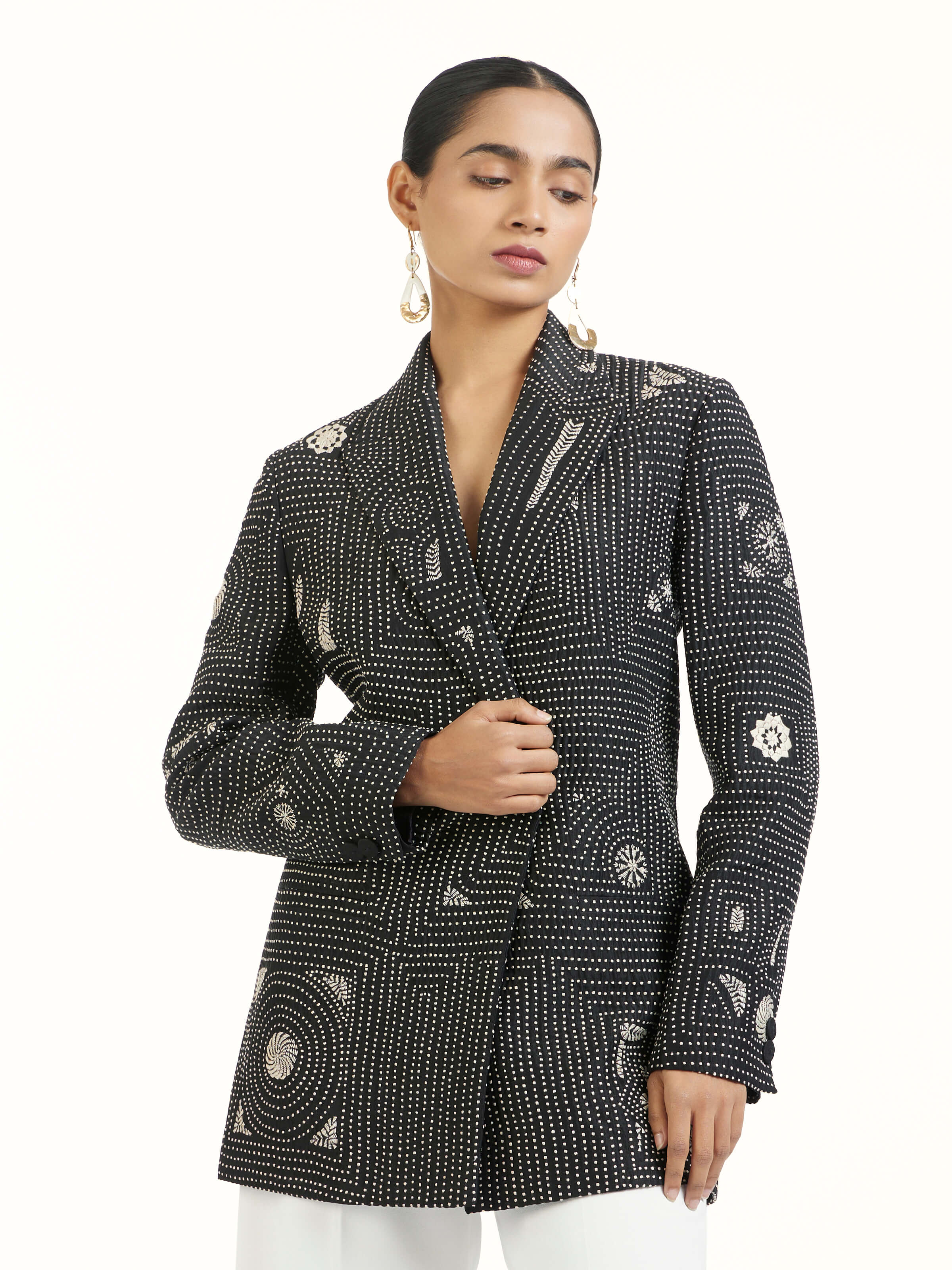 Angled view of black silk kantha jacket highlighting kantha stitching