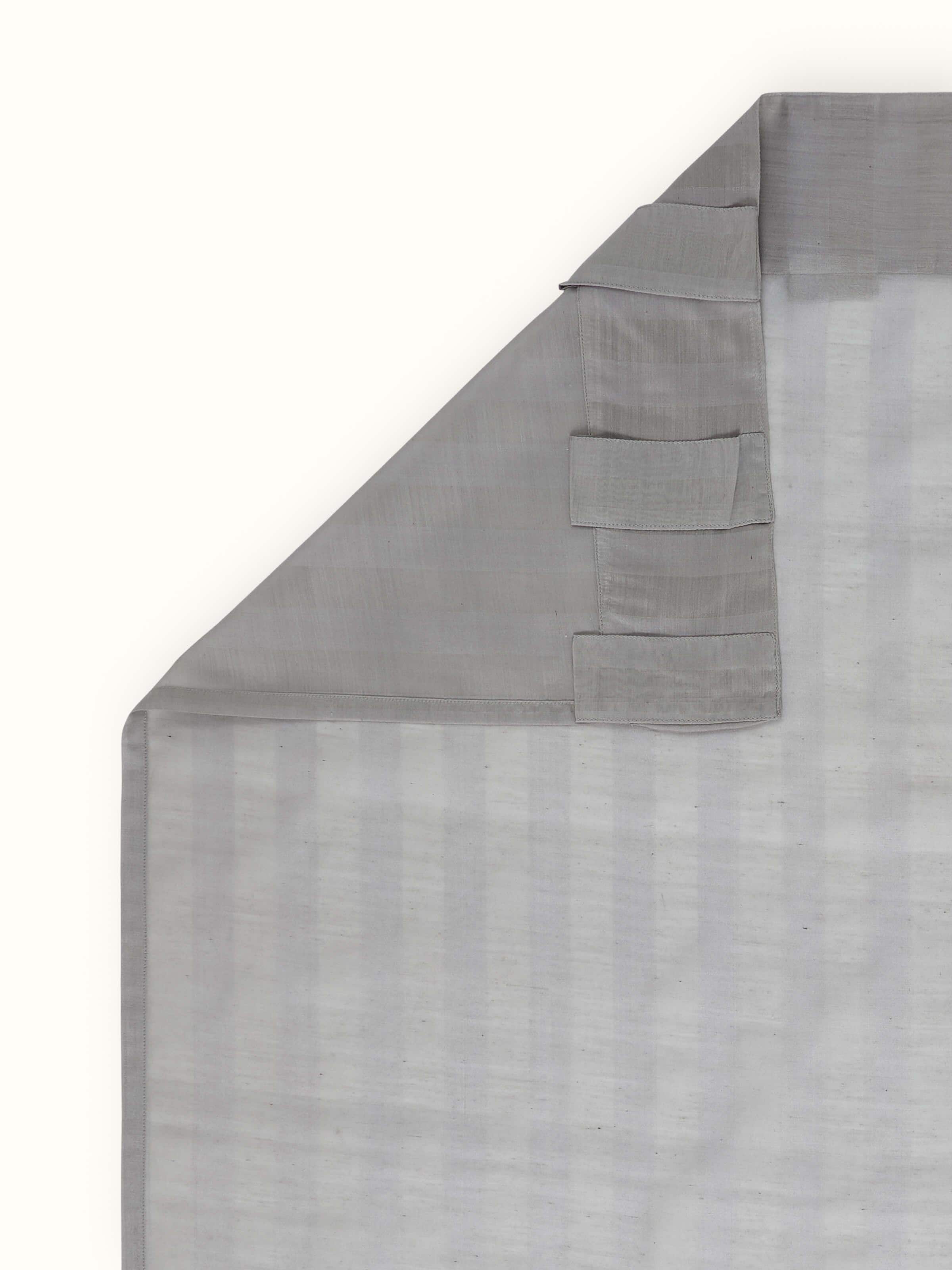 Back view of Pragya curtain in grey silk cotton, with rod pocket for easy hanging