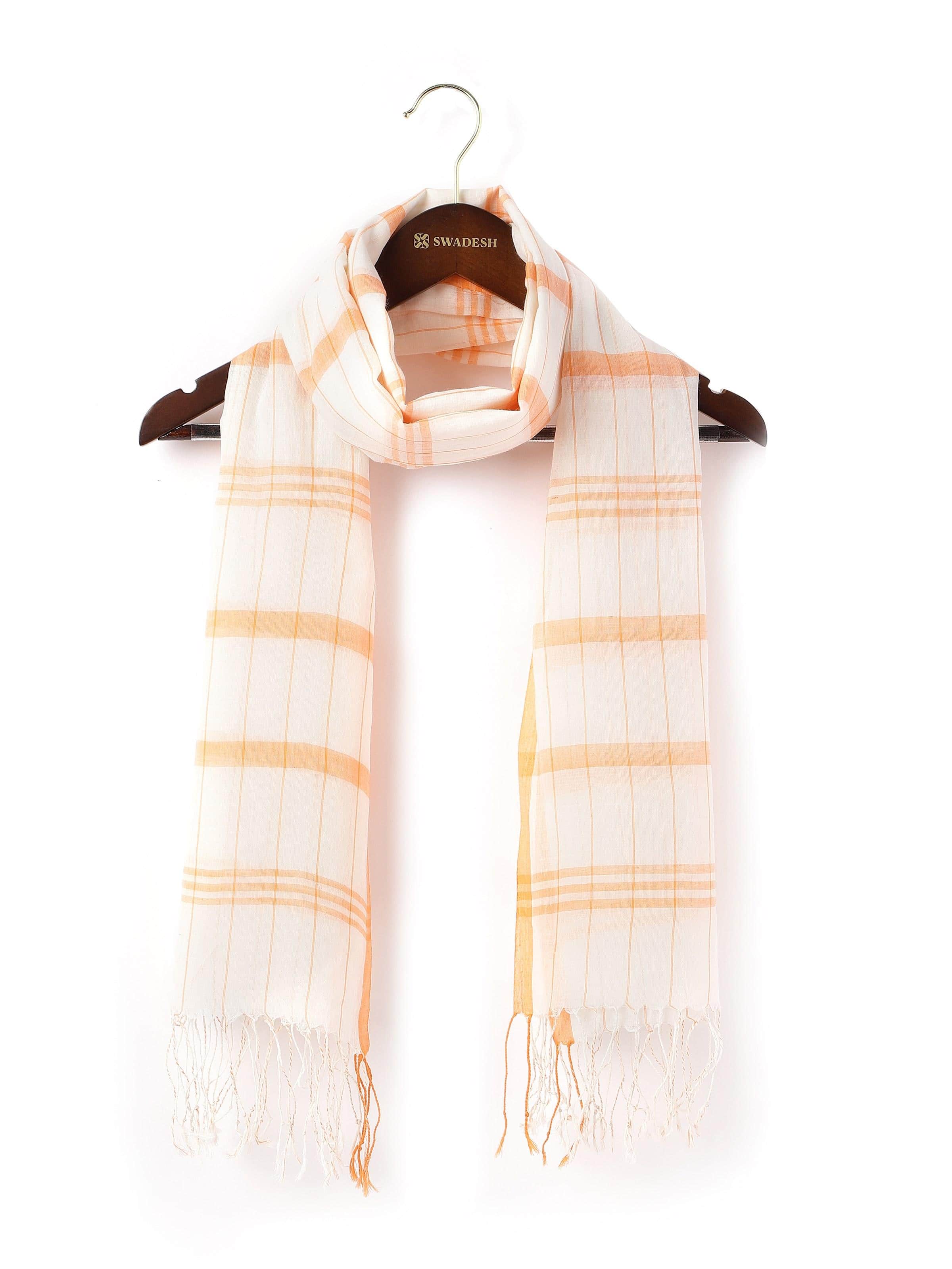Bright orange cotton stole neatly folded showing its soft texture and vibrant color.