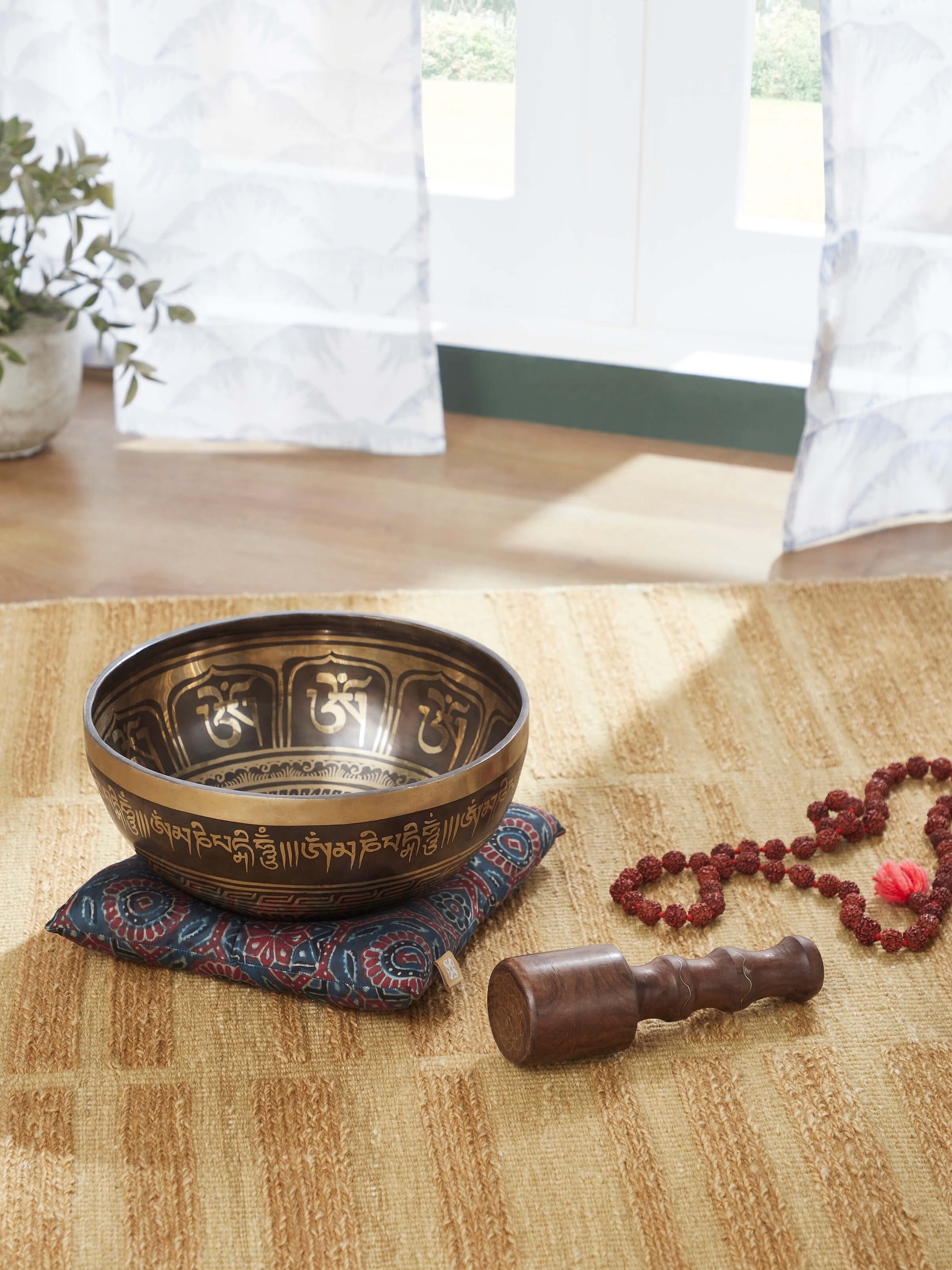 Side view of Om Mandal Singing Bowl (10 Inches) showcasing the bowl’s deep body and decorative outer ring