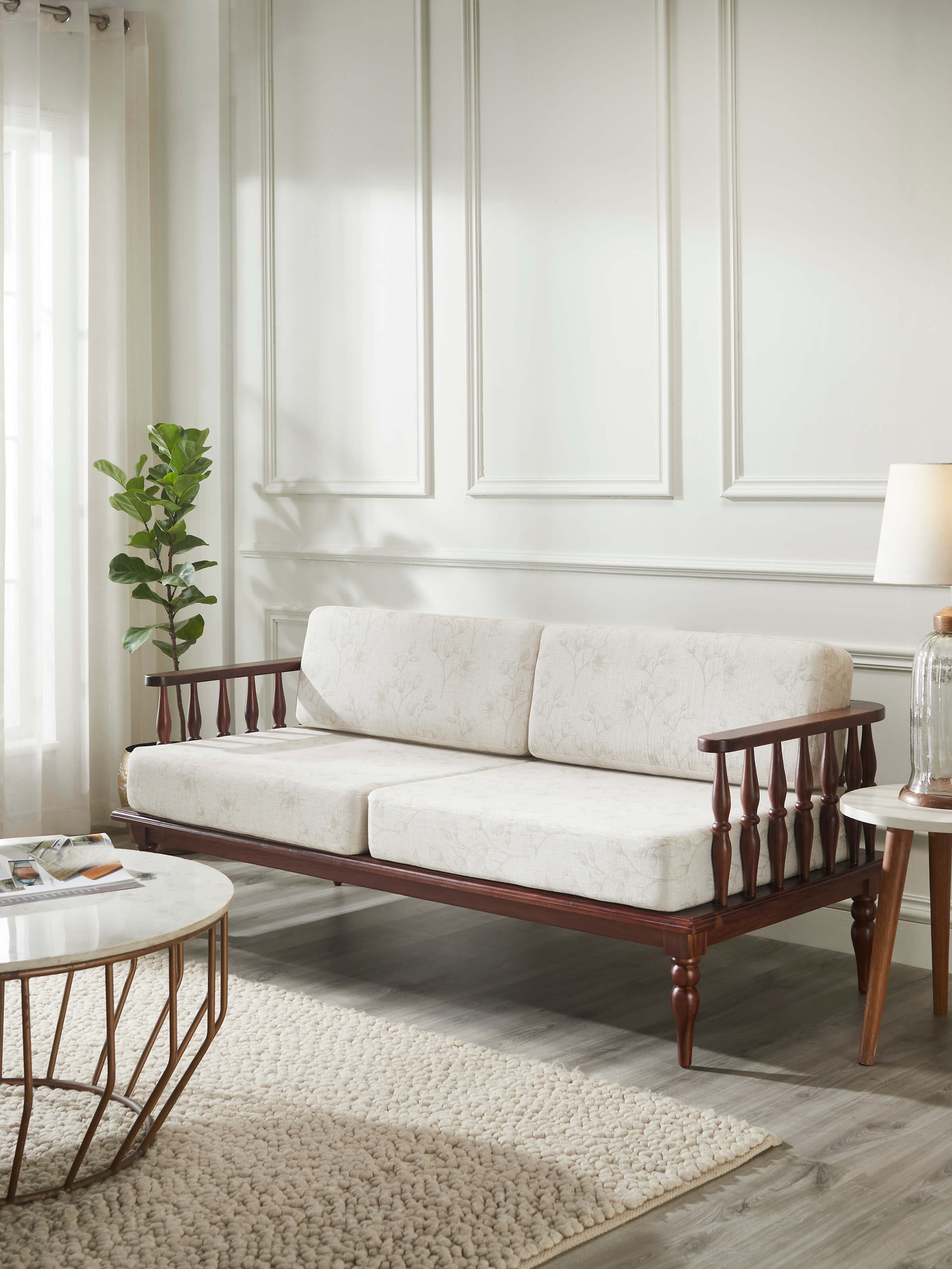 Side view of Teak Finish Upholstered Sheesham Wood 3-seater Sofa, showcasing its stylish teak finish and plush upholstery.