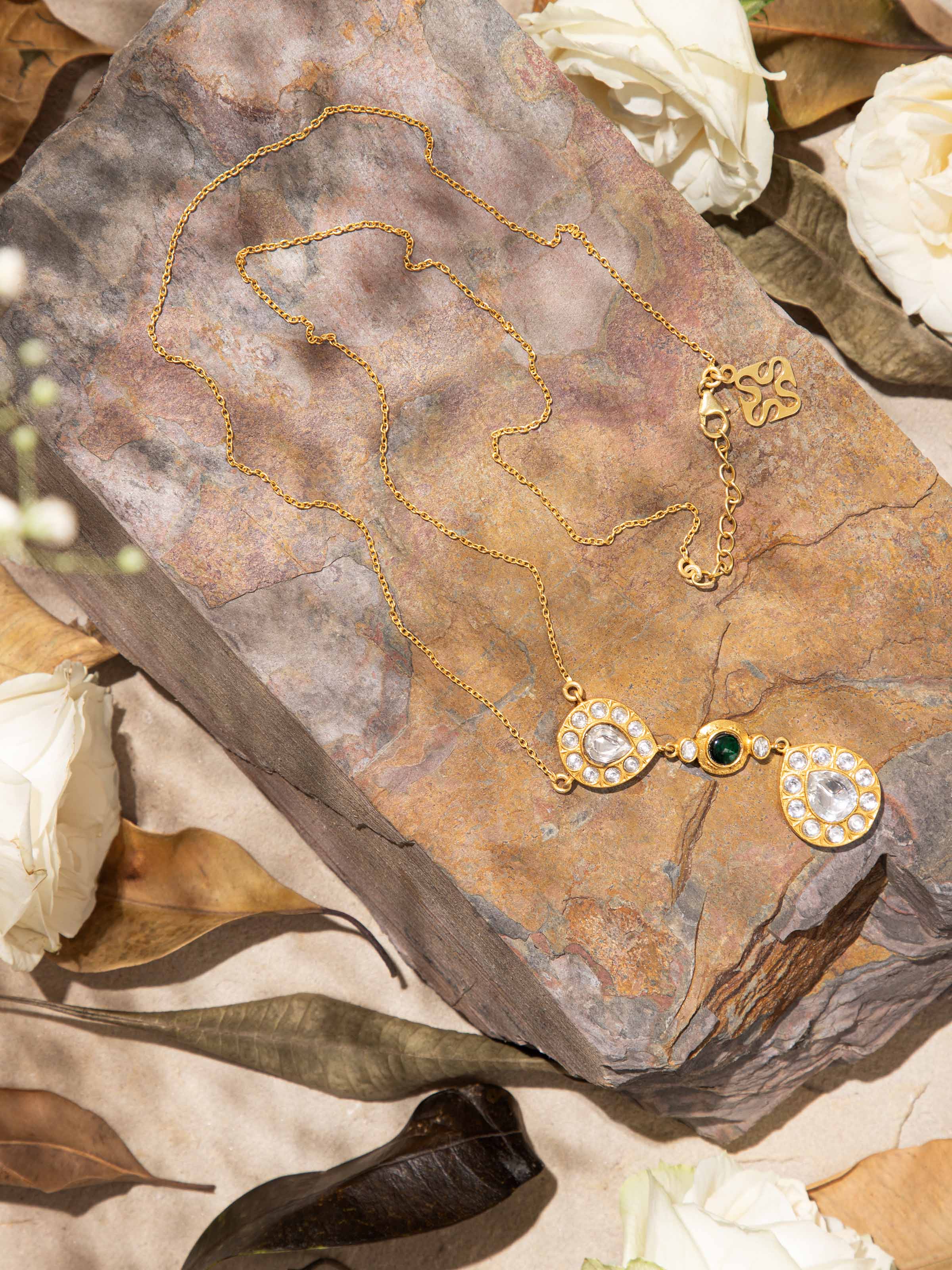 Side angle showing the fine silver detailing and pendant profile