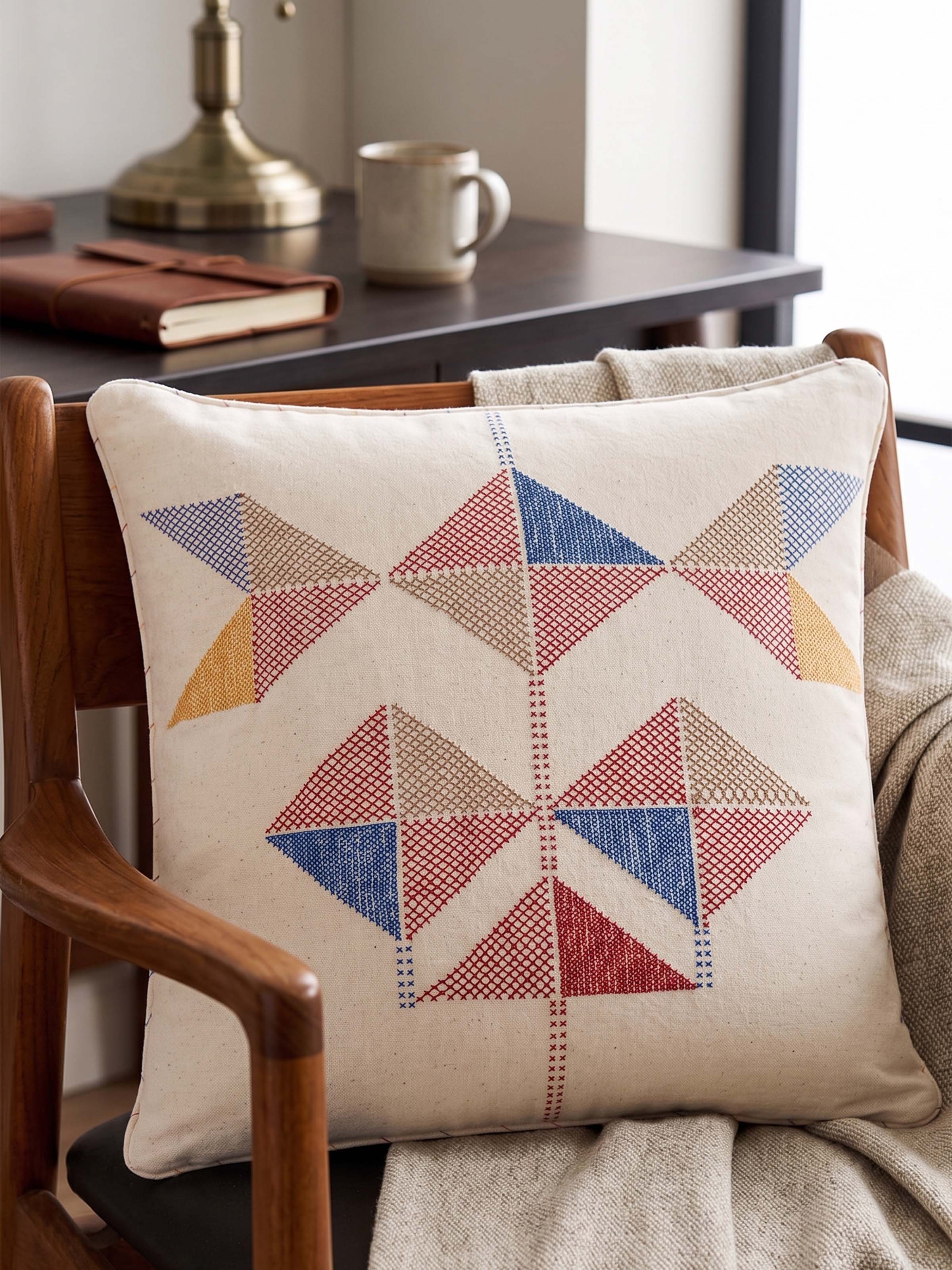 Lifestyle view of the Uttarayan Hand Embroidery Kutch Jat Cotton Cushion Cover