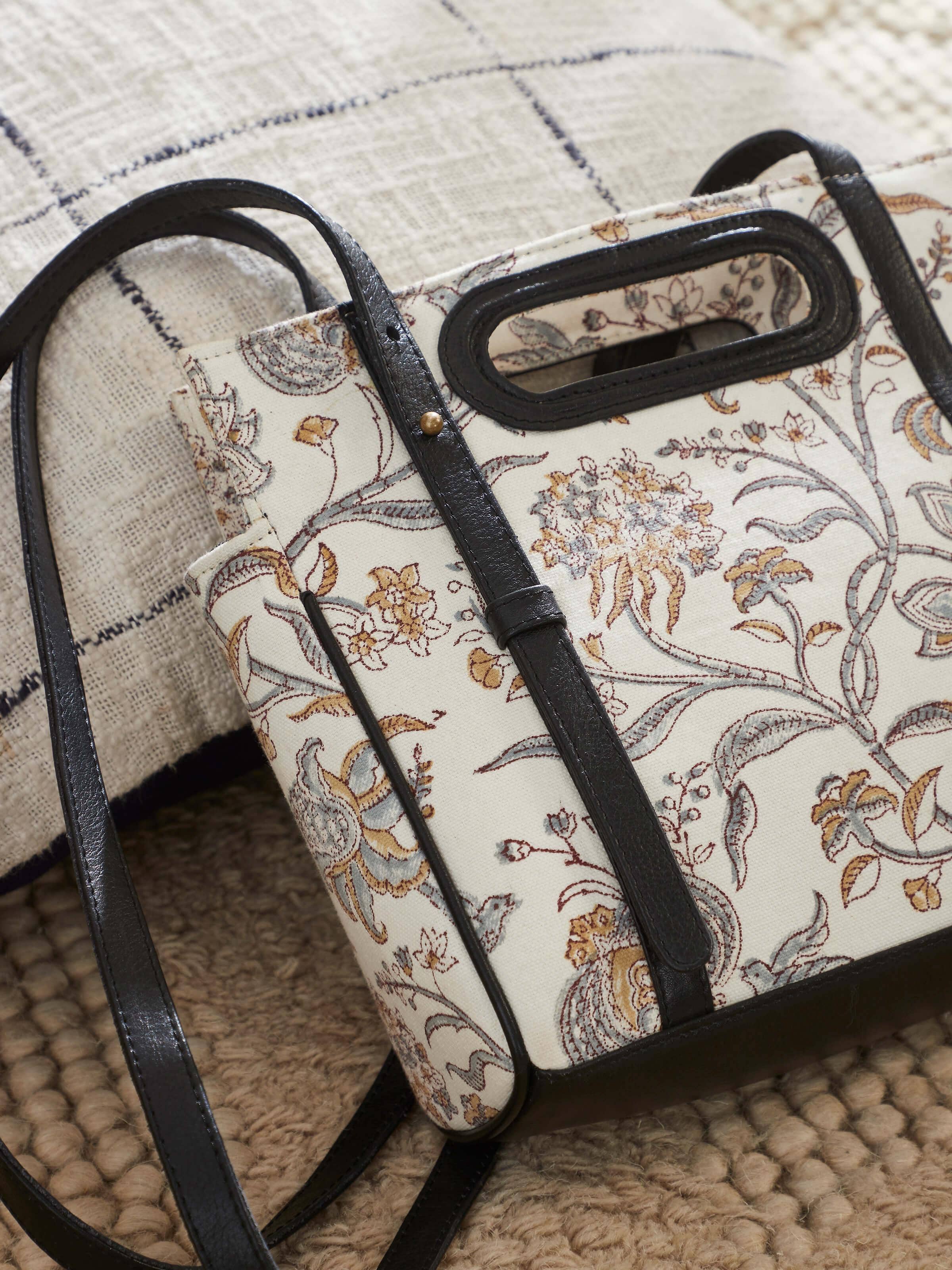 Side profile of sling bag highlighting strap design and craftsmanship.