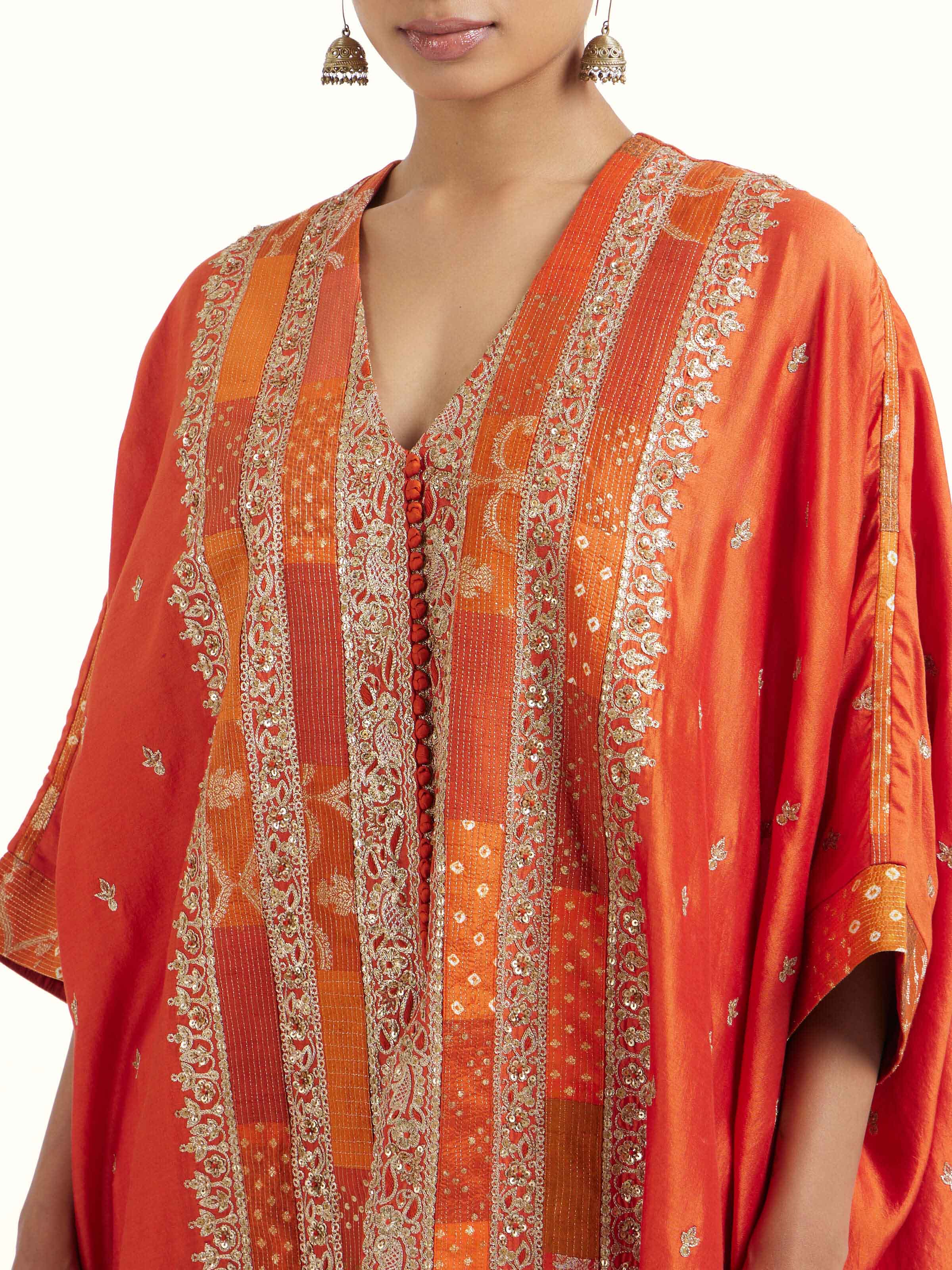 Detail view of rust silk hand embroidery co-ord set showing silk texture