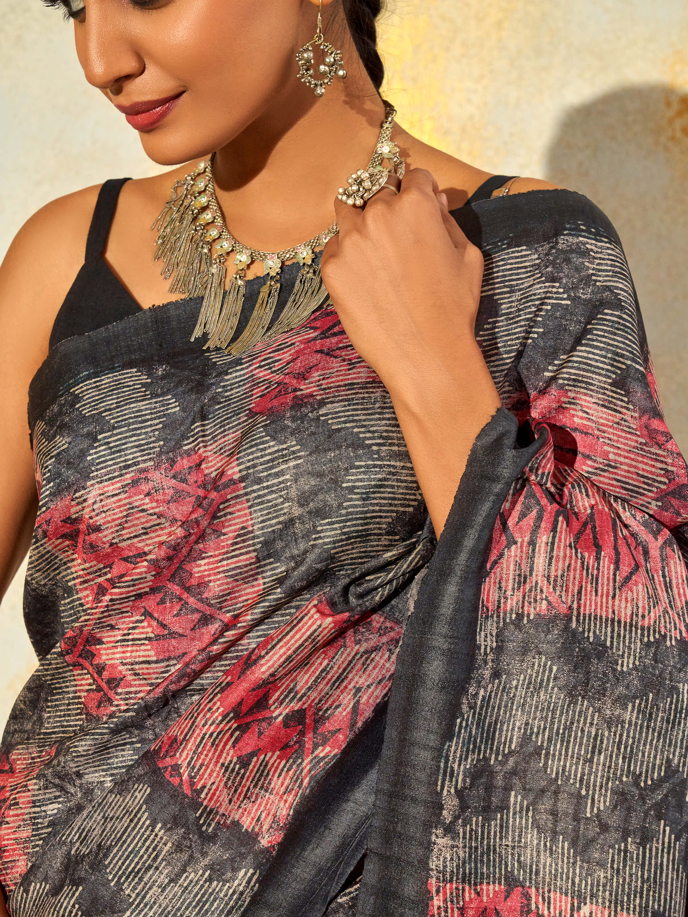 Detail view of black tussar silk discharge block printed saree showing print detail