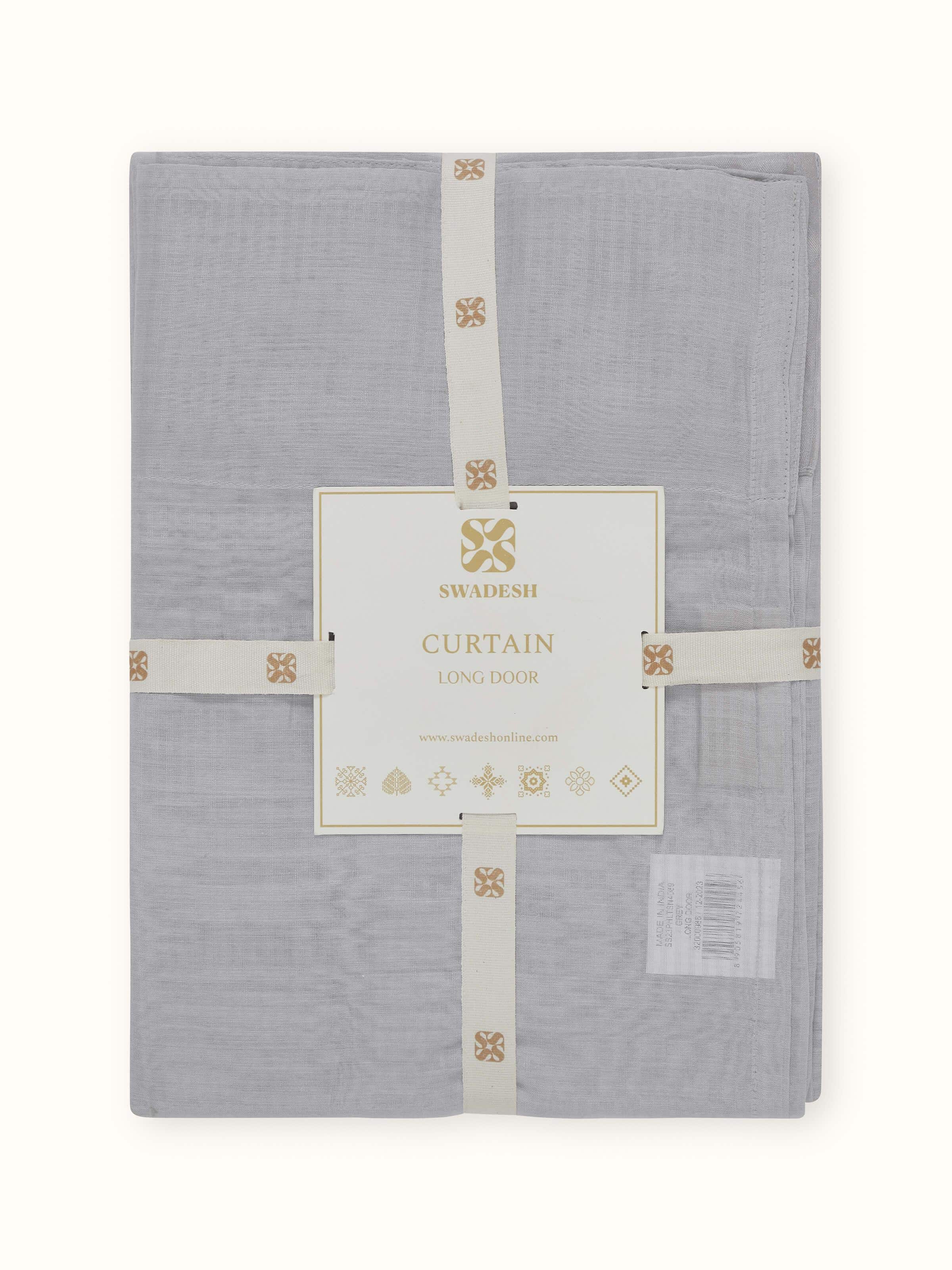 Side draped view of sheer grey curtain showing elegant fall and translucent finish.