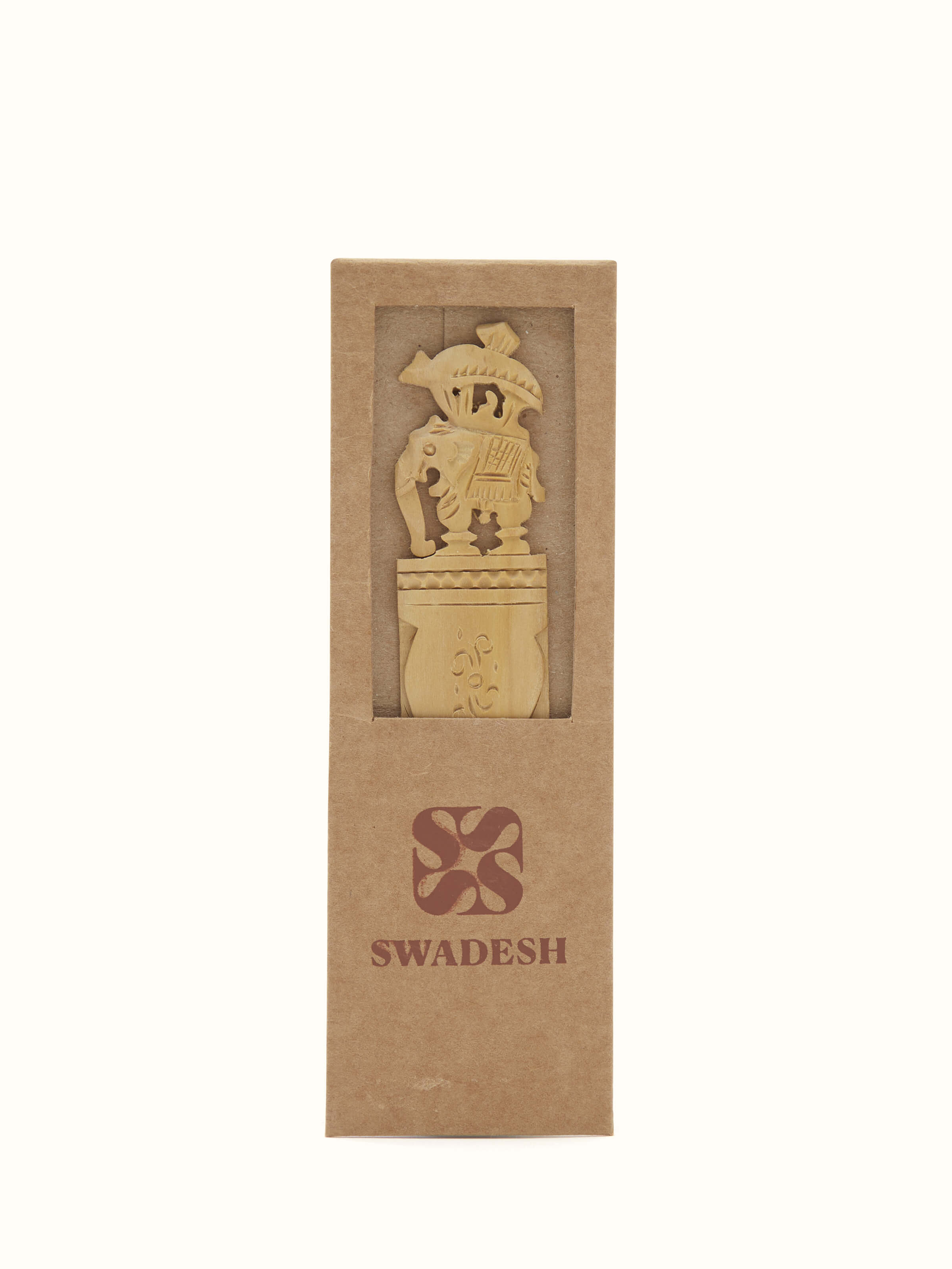 Close-up view of Carved Sandalwood Elephant Bookmark by Swadesh highlighting the fine details of the elephant design and smooth wooden texture.